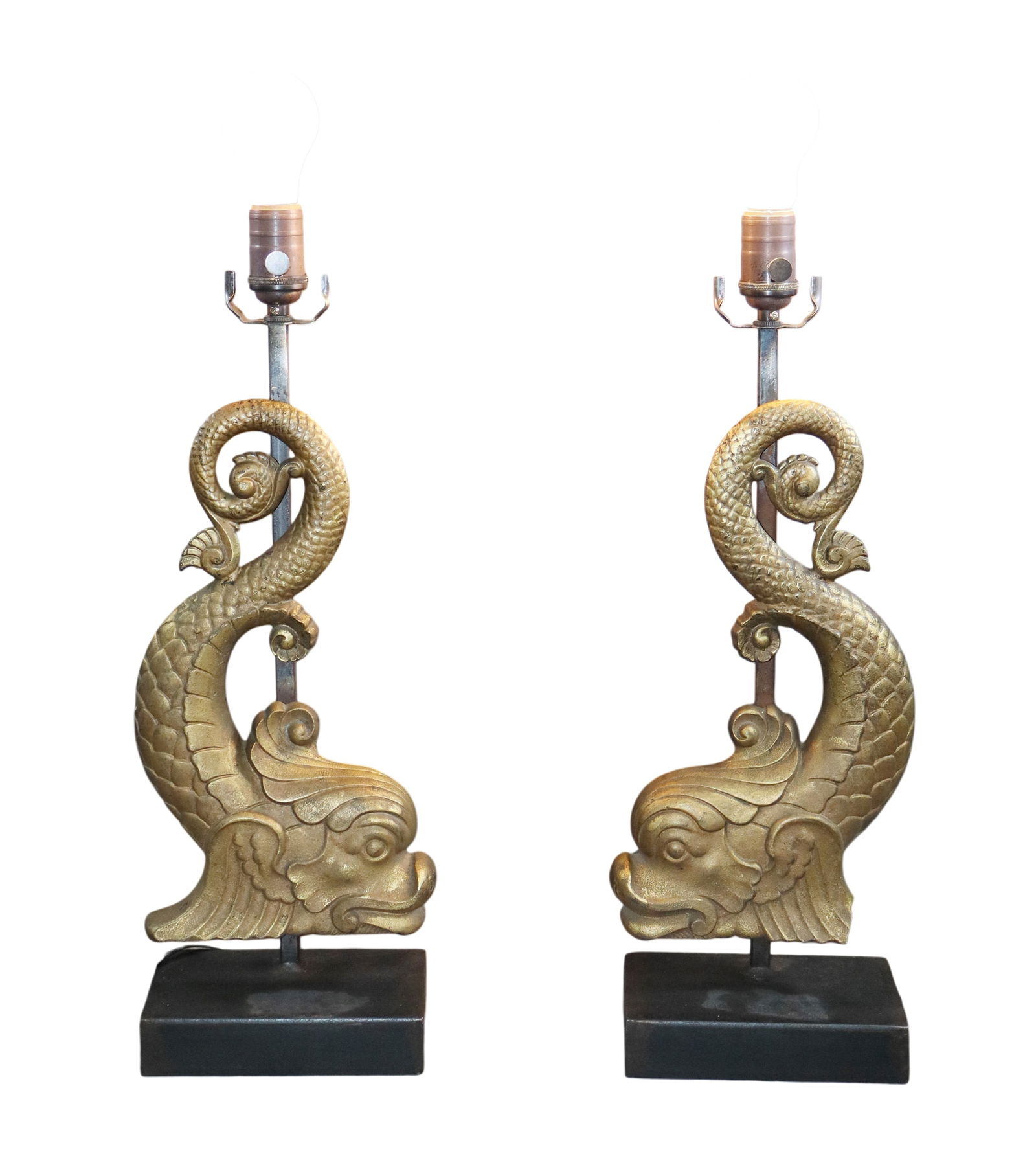 Pair of cast iron dolphin lamps: Pair of cast iron dolphin lamps. 21 3/4"h x 7 1/2"w x 4"d. Weight: 20lbs total