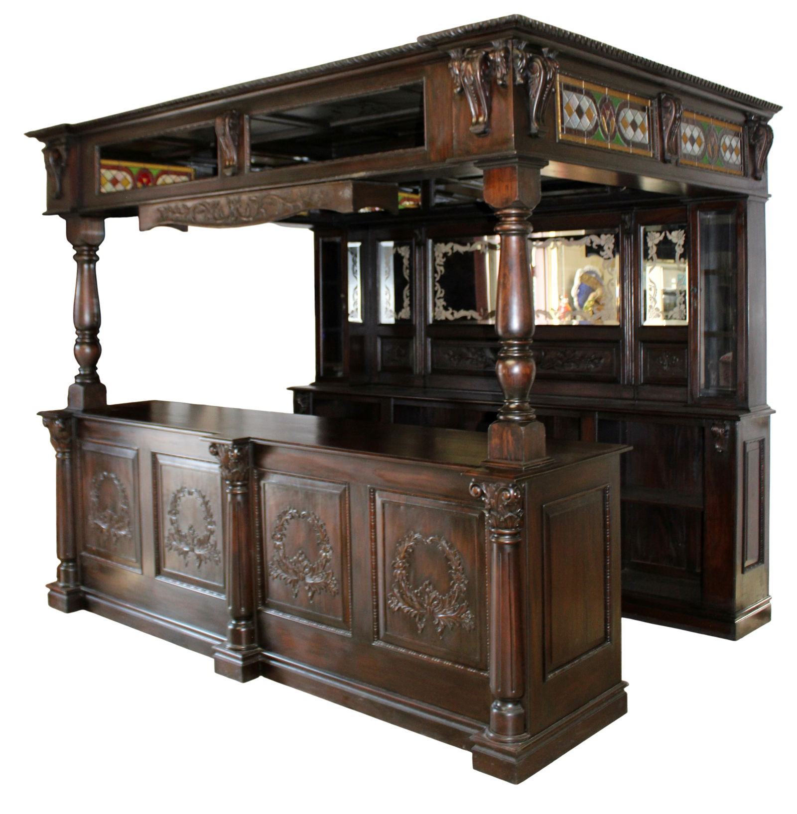 Carved mahogany canopy pub bar: Carved mahogany canopy pub bar with stained and leaded glass panels. Late 20th century. 95"h x 114 1/4"w x 84"d