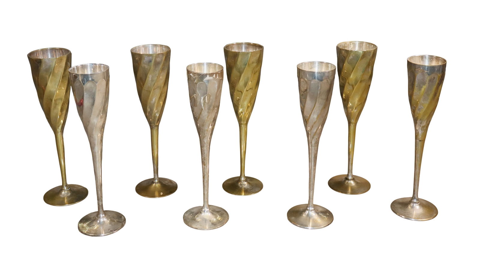 8 silver plate mid century flutes: 8 silver plate mid century flutes. 9 1/2'h x 2 3/4"w. Weight: 5lbs