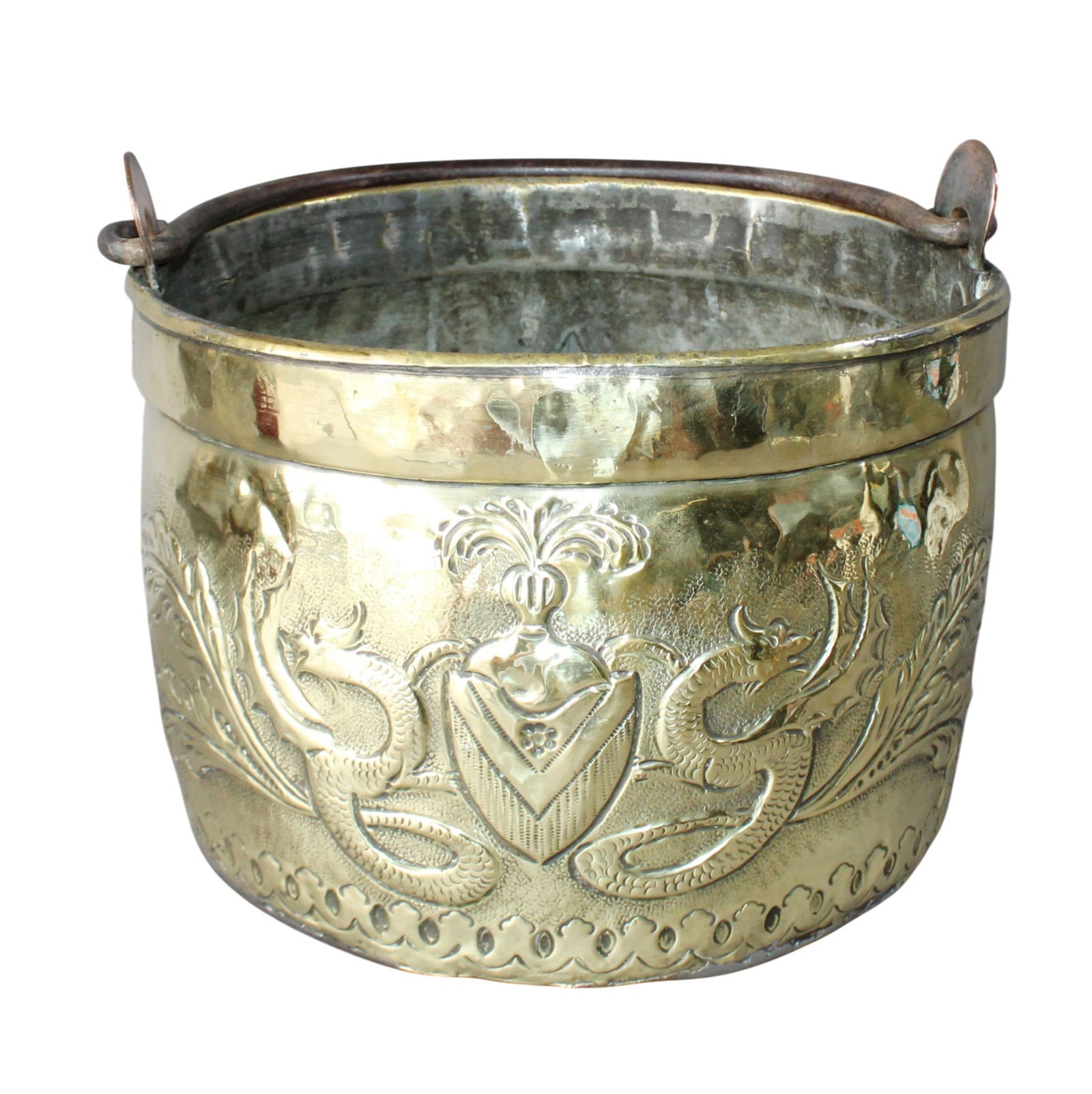 French embossed brass coal bucket with crest: French embossed brass coal bucket with crest and fleur de Lys. 19th century. 10 1/4"h x 12 3/4"w x 11"d. Weight: 5lbs