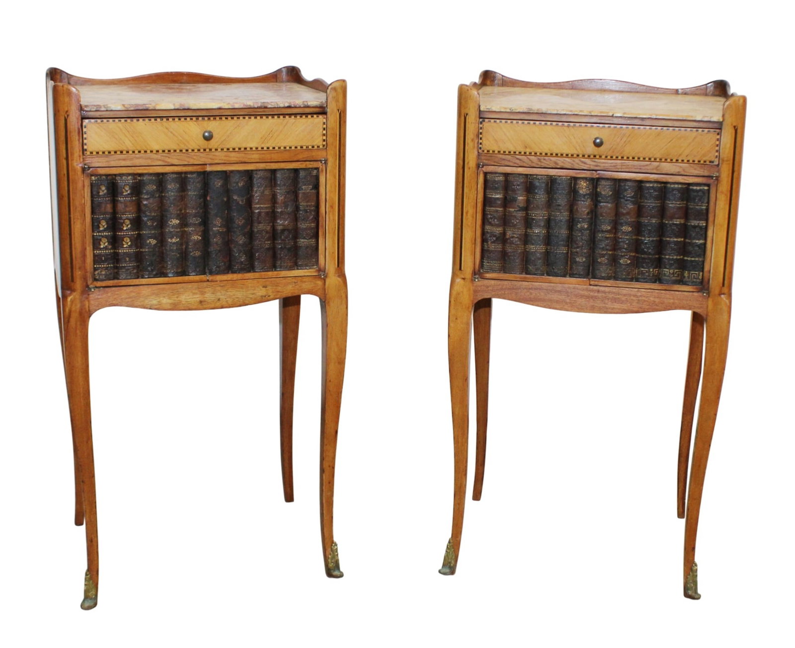 Pair of French side tables with faux book facade doors and a marble top: Pair of French side tables with faux book facade doors and a marble top. Late 19th century. 29 1/4"h x 15"w x 12 1/4"d