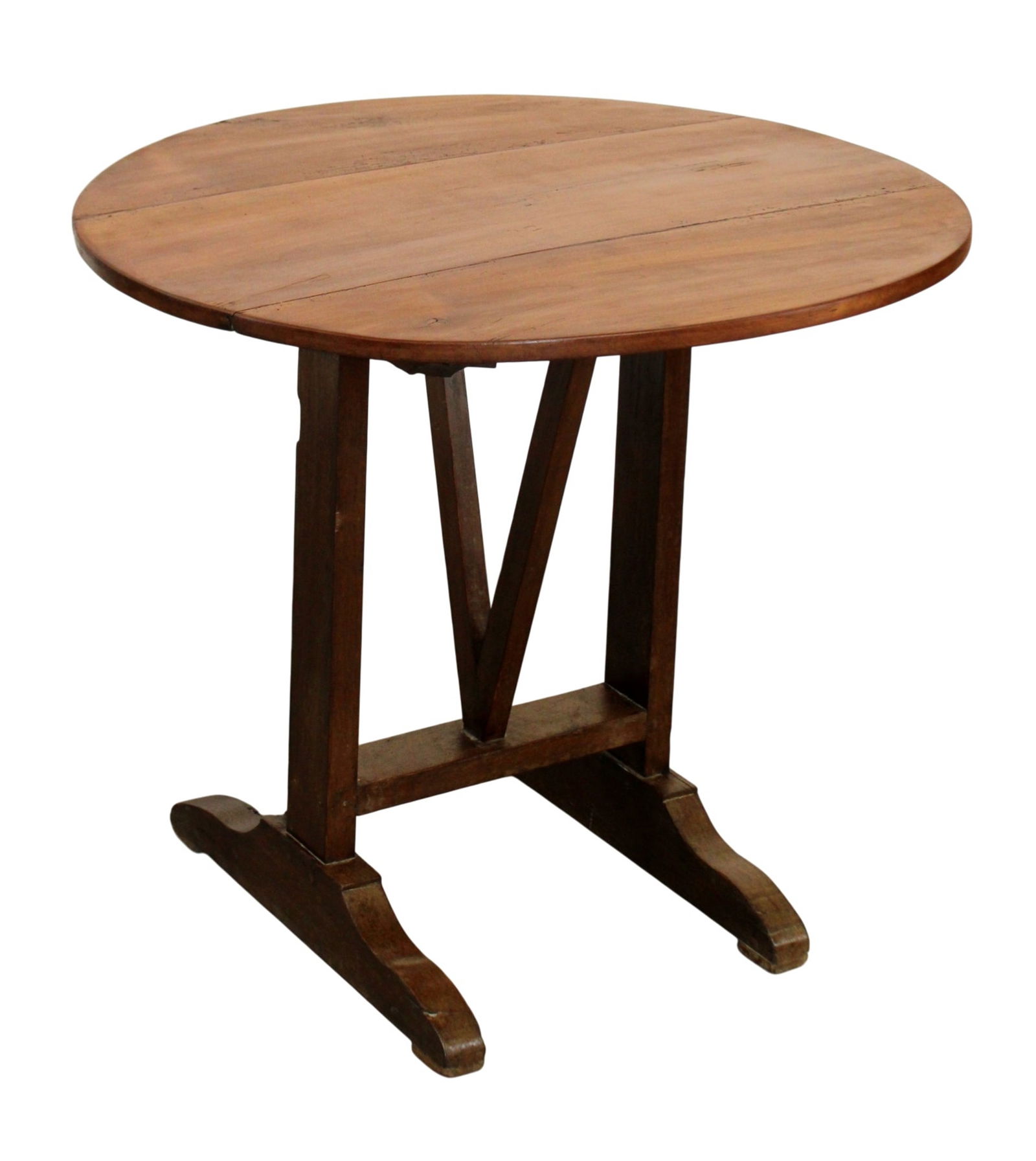 French tilt top vintners table in mixed woods: French tilt top vintners table in mixed woods. Late 19th century. 28 1/4"h x 32 1/4"dia (43"h with top up) Base 21 1/2"w at base