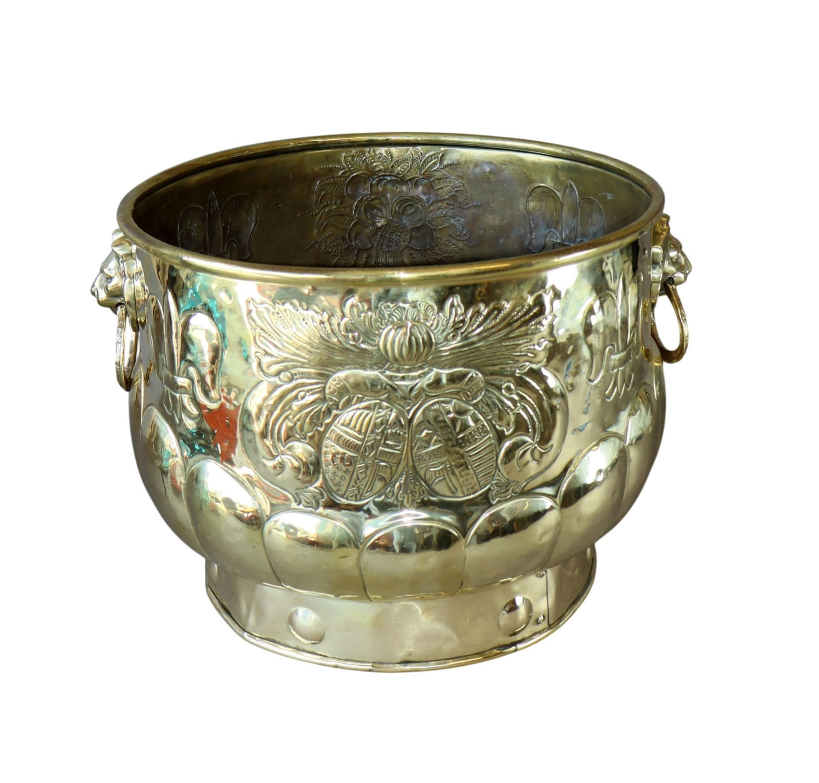 French embossed brass cache pot with lion masks and coat of arms: French embossed brass cache pot with lion masks and coat of arms. 19th century. 12 3/8"h x 19"w with handles, 16 3/8"di. Weight:8lbs