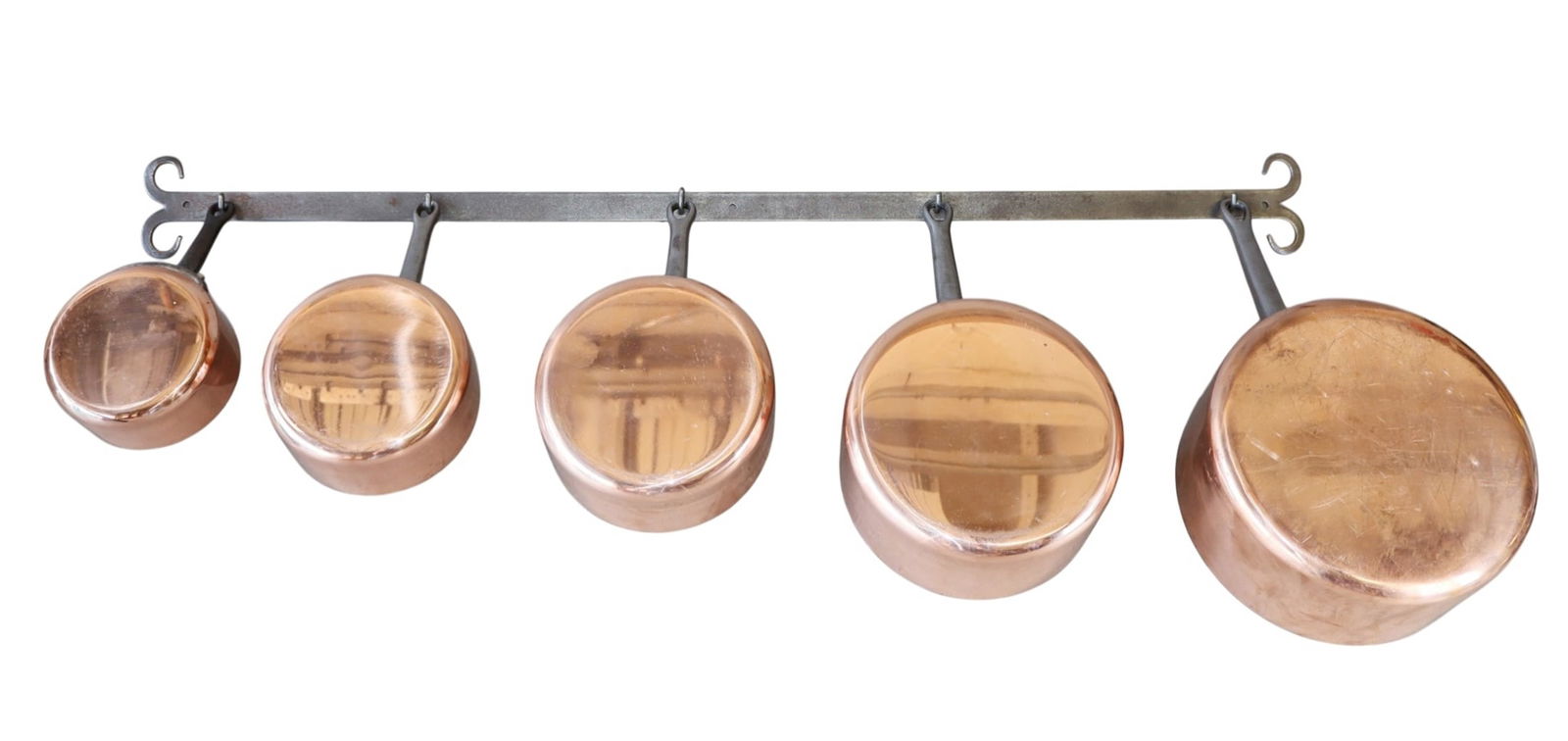 Set of 5 French copper sauce pans on forged iron rack: Set of 5 French copper sauce pans on forged iron rack. Pots marked Fabrication Francaise. Pots circa 1950's. Rack Range: 8"h x 8"dia- 5"hx 5"dia. Bar: 3/4"h x 38 1/2"w. Total weight: 16lbs