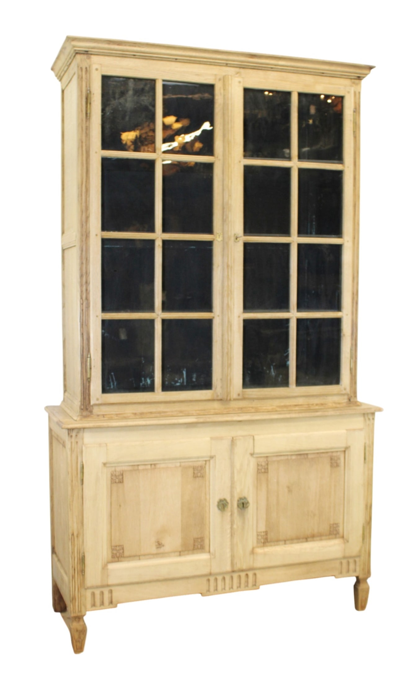 French Louis XVI bookcase in bleached oak with paned glass doors: French Louis XVI bookcase in bleached oak with paned glass doors. 19th century. 91"h x 53"w x 19 1/2"d