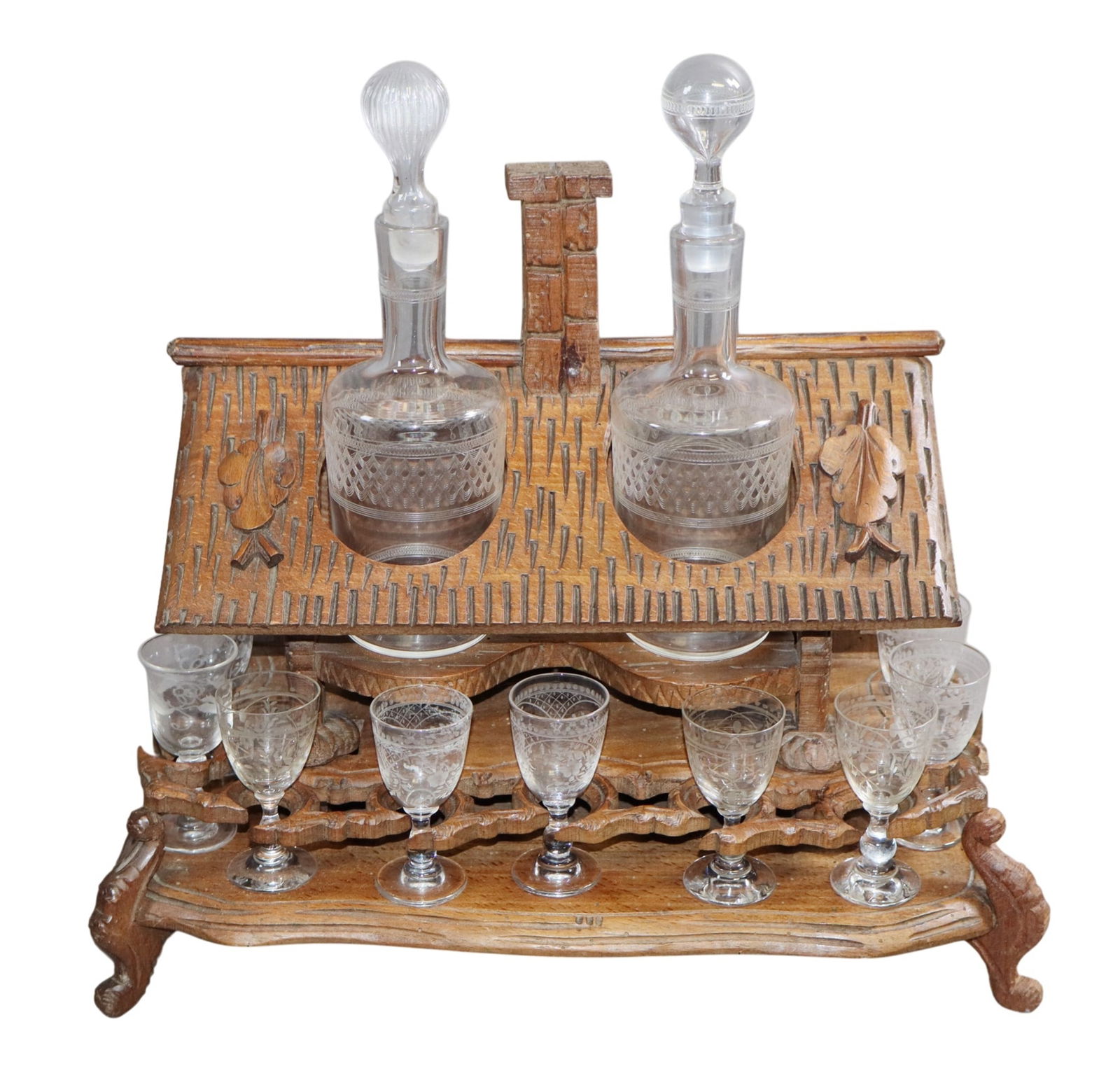 Black Forest form carved tantalus set with 2 decanters and 12 cordial glasses (1 of 8)