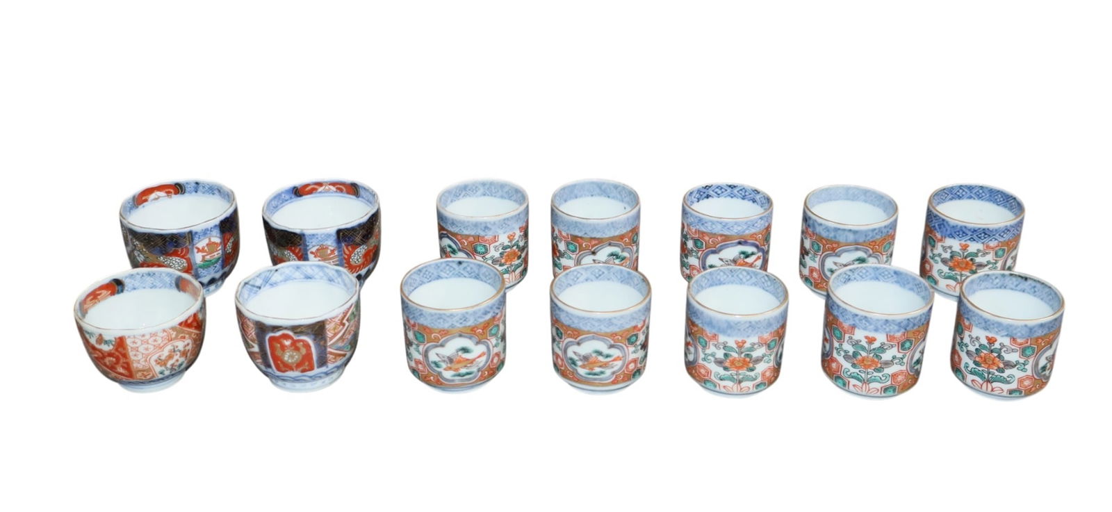 Lot of 14 Japanese Imari porcelain tea or sake cups: Lot of 14 Japanese Imari porcelain tea or sake cups. 1 7/8"h x 2 1/8"dia - 2 3/4"h x 1 5/8"dia. Weight: 1.5 lbs. total