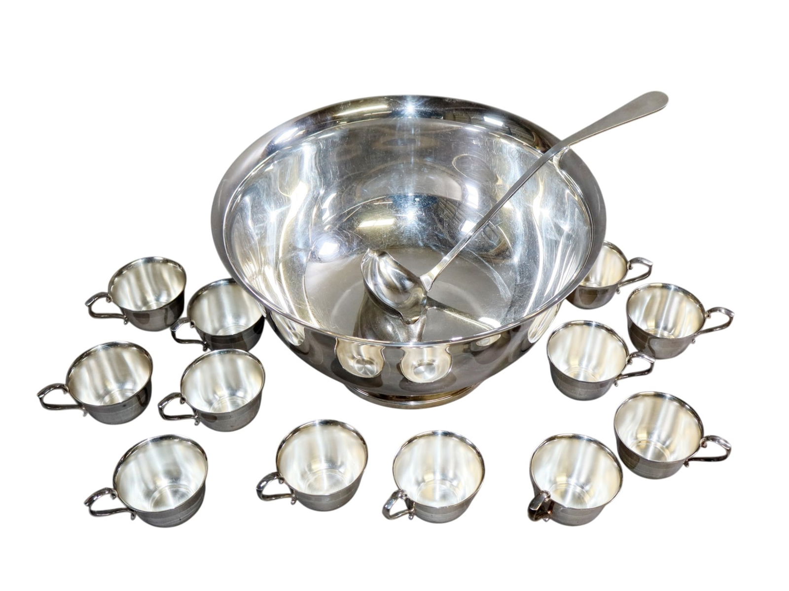 Gorham silverplate punchbowl with ladle and 12 cups: Gorham silverplate punchbowl with ladle and 12 cups. Cups: 2 1/4"h x 3 1/8"dia. Bowl: 7 1/2"h x 14"dia. Total weight: 5lbs