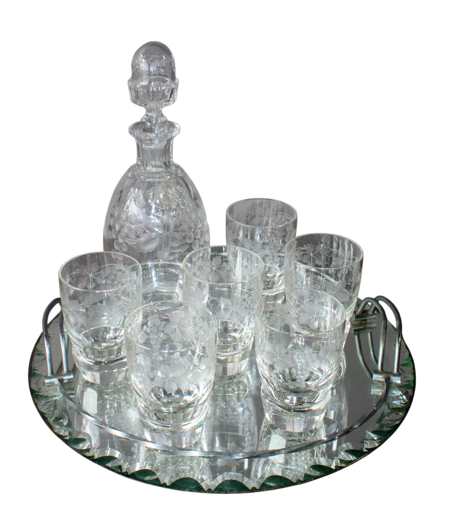 French etched crystal decanter with 6 glasses with grape vine etching on mirrored tray: French etched crystal decanter with 6 glasses with grape vine etching on mirrored tray. Decanter: 11"h x 4"dia Glasses: 4"h x 2 3/4"dia Tray: 2 1/2"h x 14 1/4"dia Weight: 7.5 lbs.