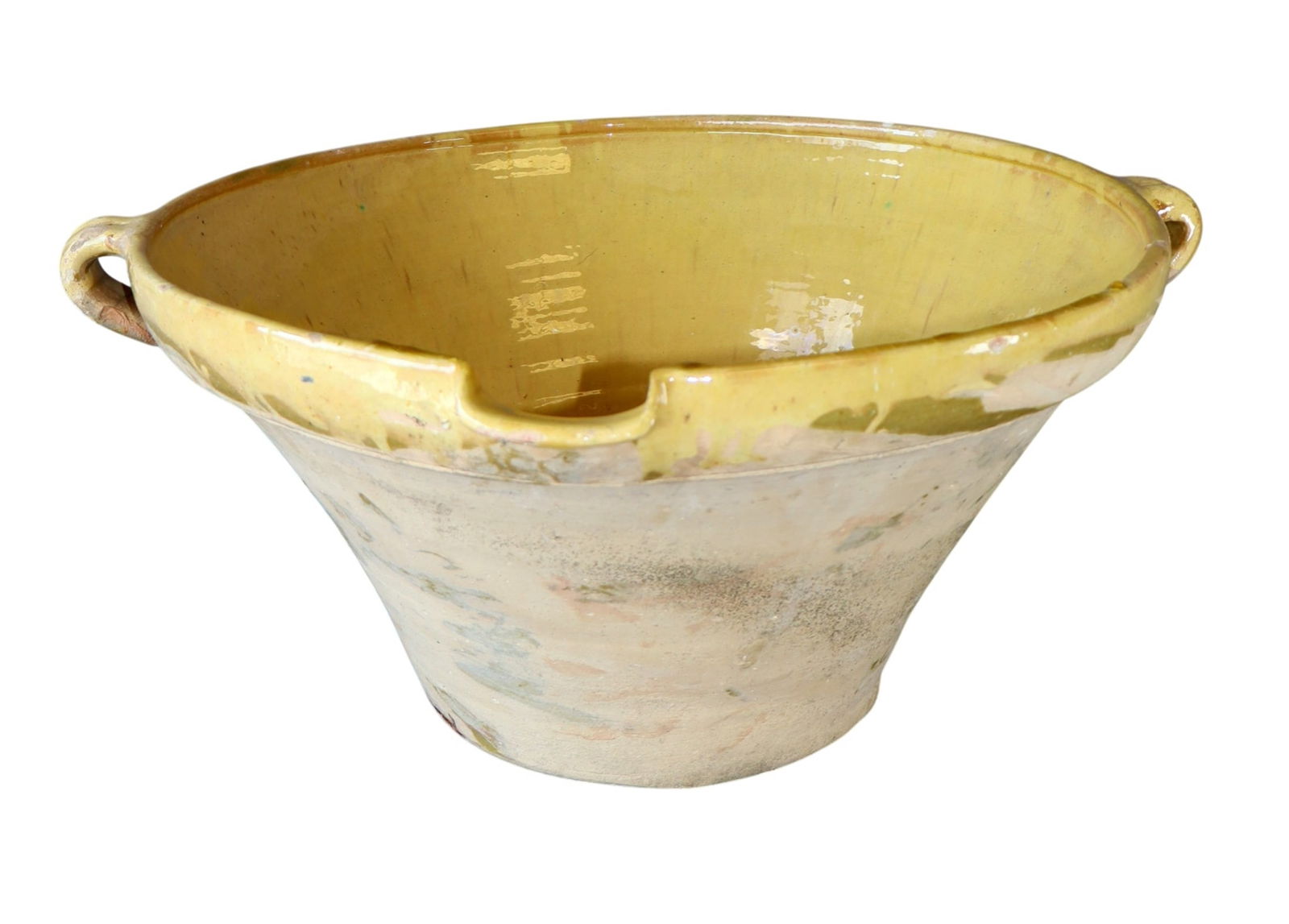 French yellow glazed terra cotta tian bowl: French yellow glazed terra cotta tian bowl. 10"h x 22 1/4"w x 20 1/8"d. Weight: 18lbs