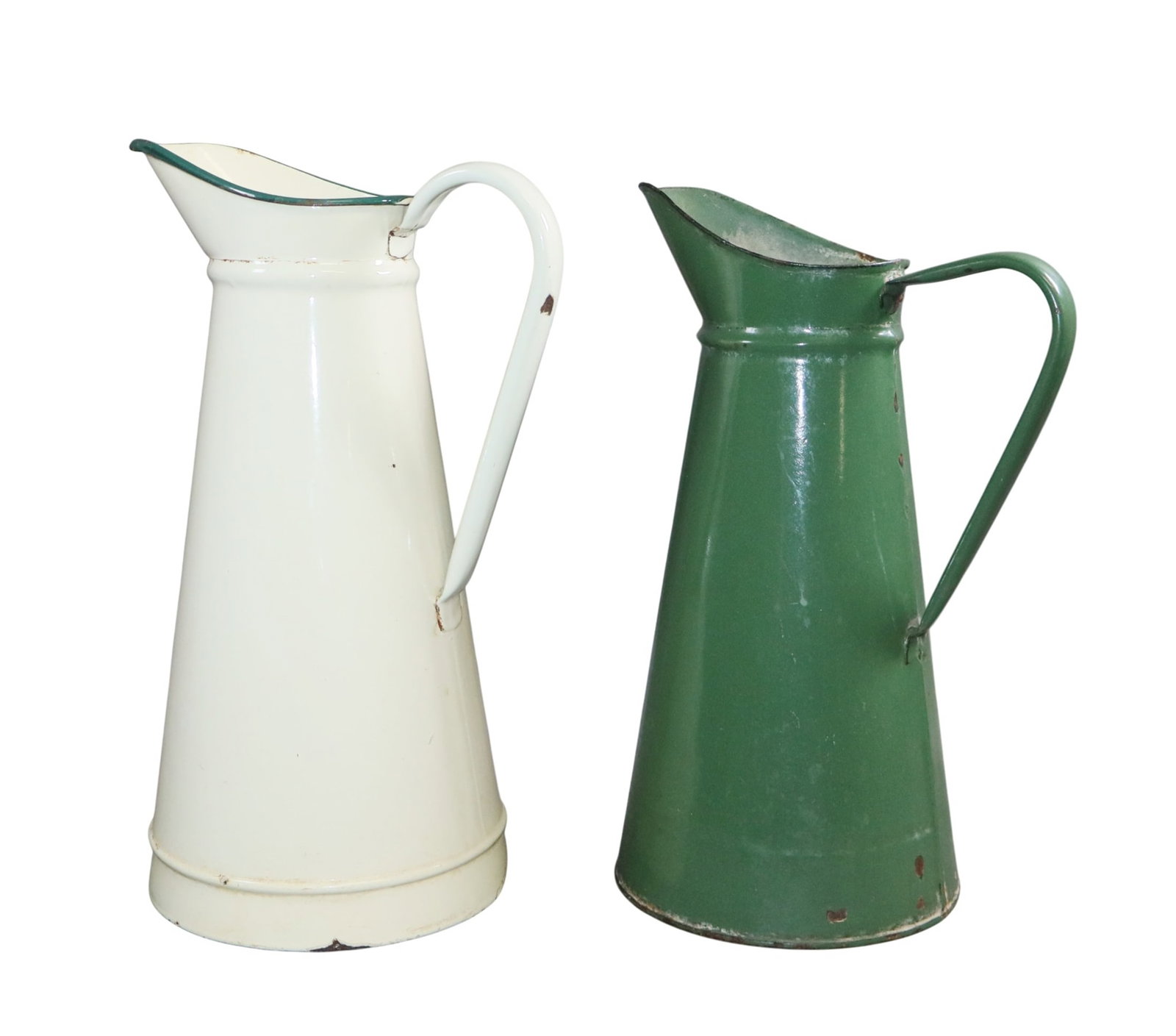 Lot of 2 French enamelware pitchers, green + white: Lot of 2 French enamelware pitchers, green + white. Green: 14 3/4"h x 10"w x 7 3/8" dia across bottom. White: 15 1/2"h x 10"w x 7 3/4" dia across bottom. Total weight: 4lbs