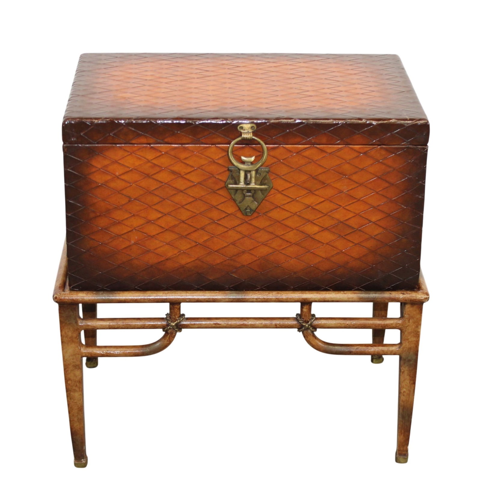 Maitland Smith embossed trunk on metal stand: Maitland Smith embossed trunk on metal stand. Modern. 24 1/2"h x 22 1/4"w x 14 1/8"d