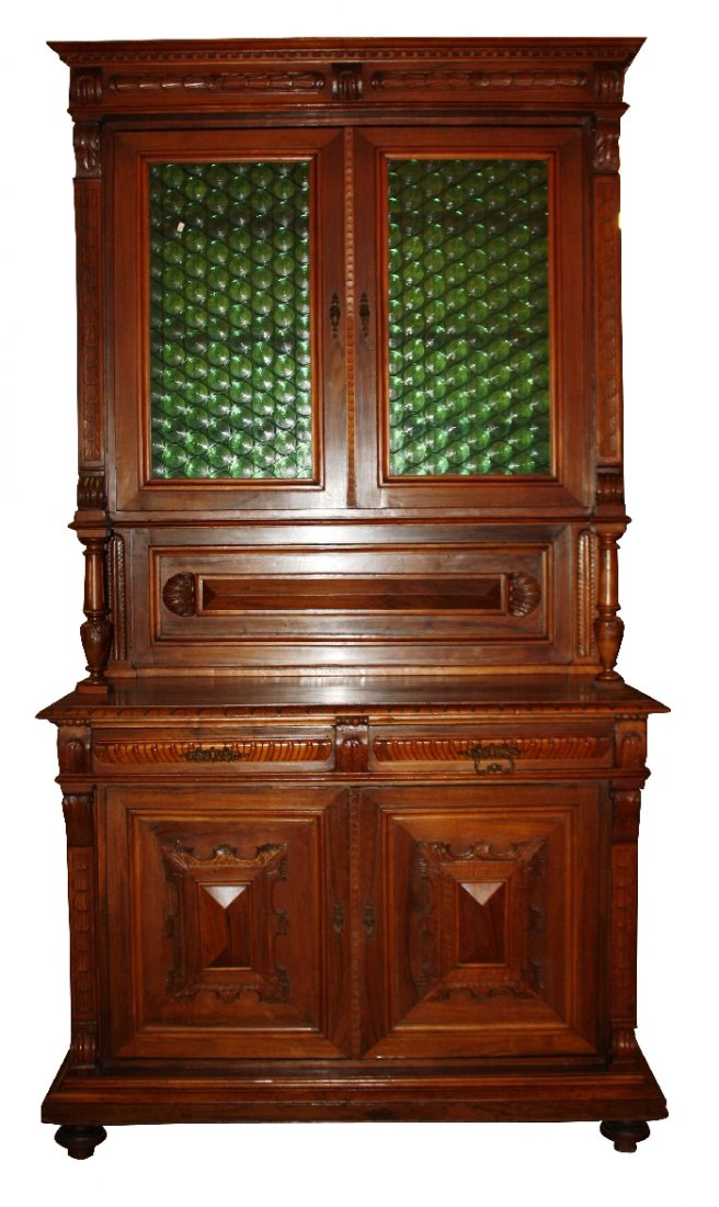 French walnut buffet with green bulls eye glass doors: and carved raised paneling. 97"h x 52 3/4"w x 25"d
