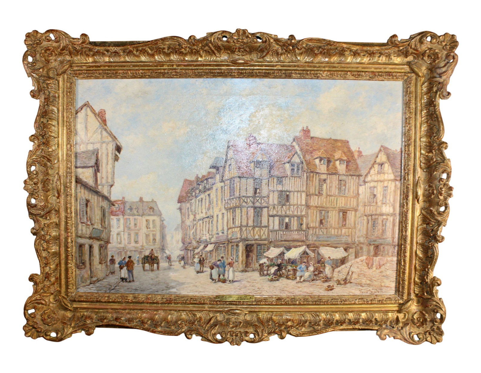 French Pierre Le Boeuff oil on canvas painting village scene 'Lisieux': Pierre Le Boeuff French 1899-1920 oil on canvas painting village scene 'Lisieux.' Marked on back Vieilles Maisons Lisieux. 27"h x 37 1/2"w x 3 1/2"d Sight: 19 3/8"h x 29 3/8"w. Weight: 14lbs