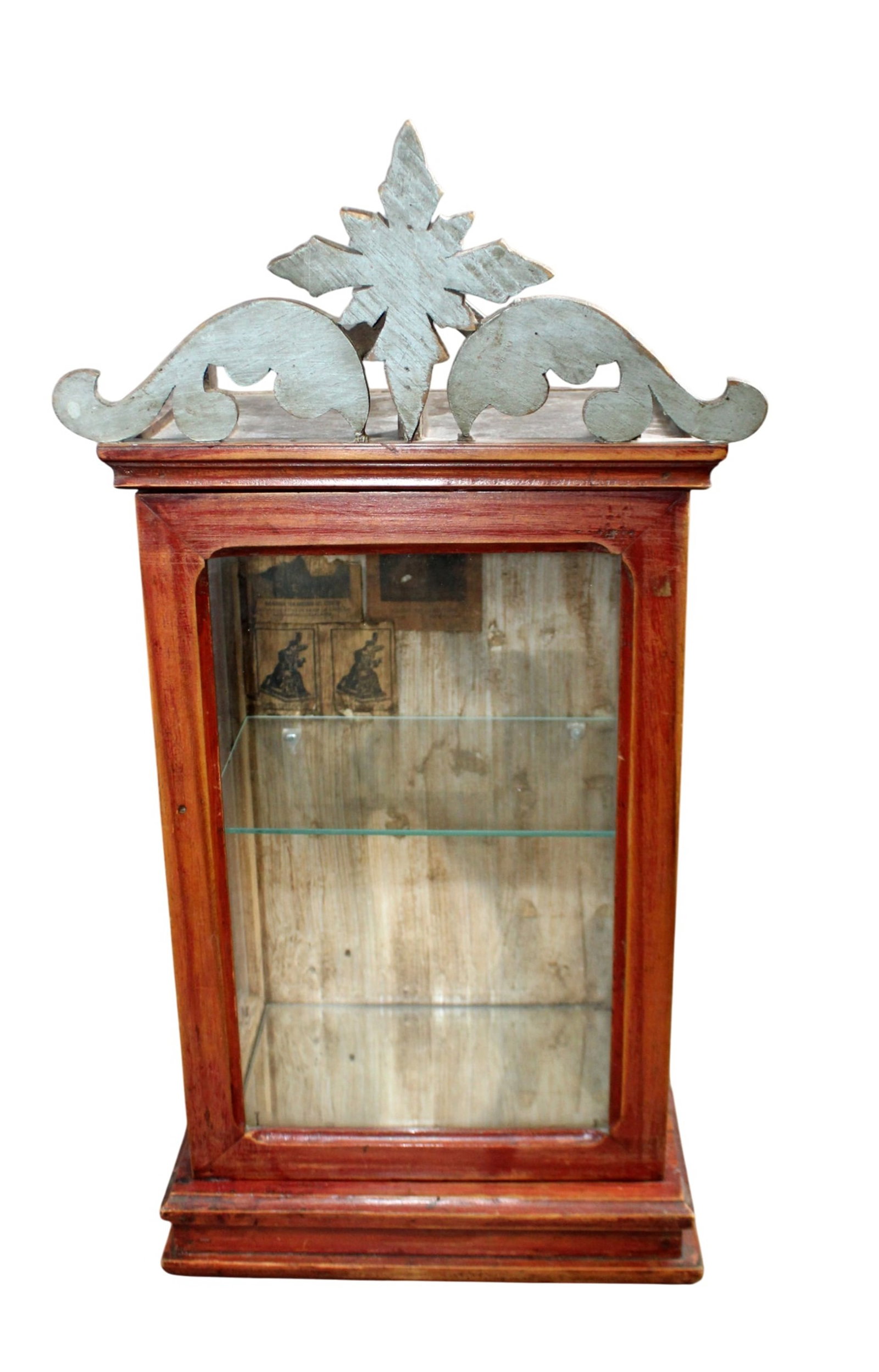 Petite showcase with carved crest and mirrored bottom: Petite showcase with carved crest and mirrored bottom. Late 19th century. 23 3/4"h x 11 1/2"w x 8 5/8"d. Weight: 9lbs