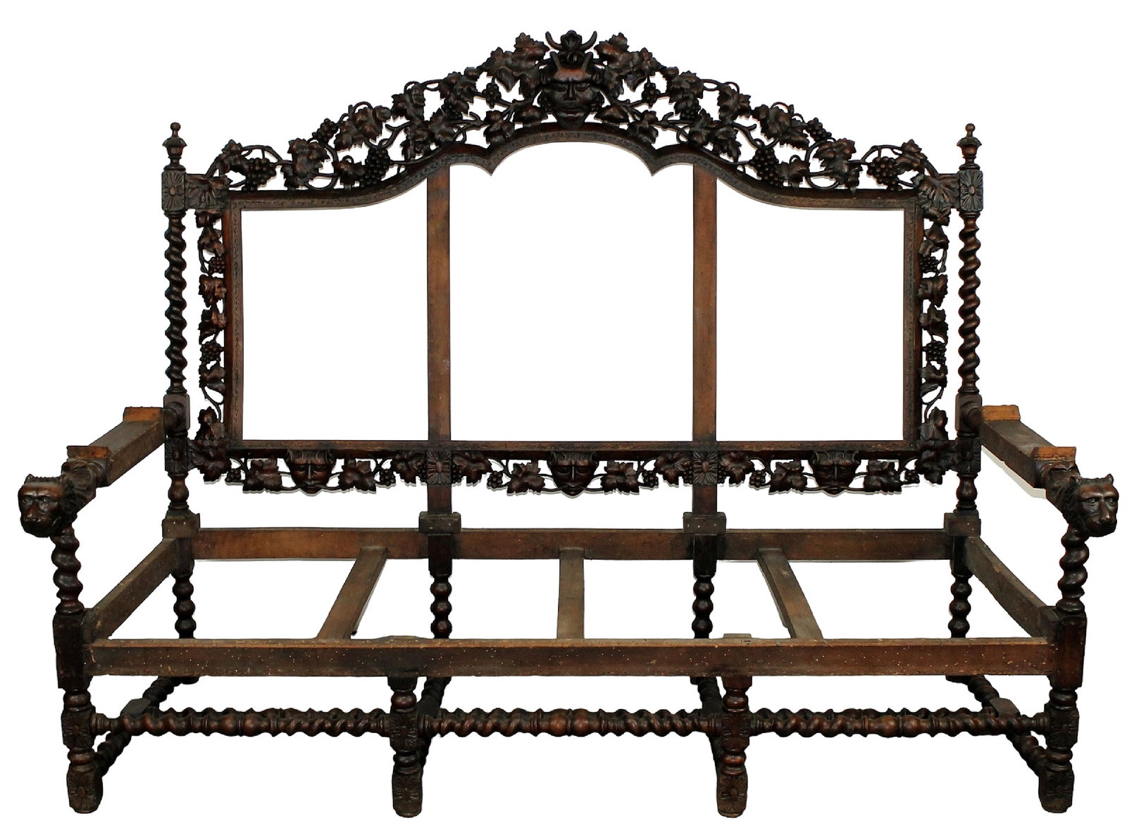 French heavily carved sofa frame with Bacchus mask: French Louis XIII carved walnut sofa frame with focal mask and grape vine motif with barley twist supports. 19th century. 55 1/2"h x 75"l x 32"d