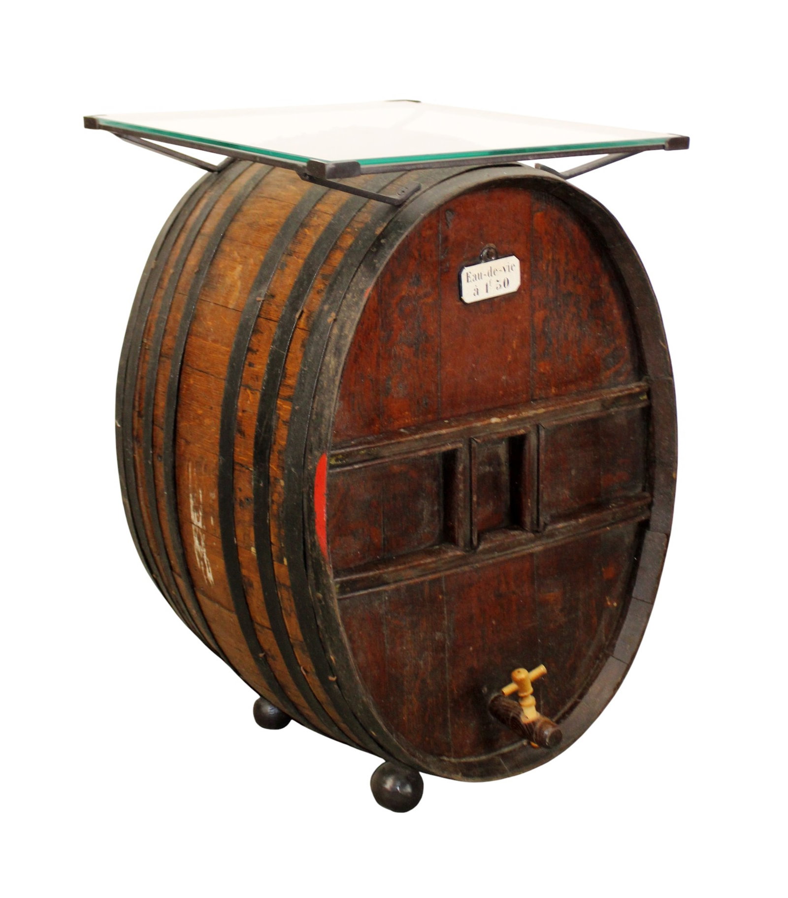 French eau de vie barrel mounted with glass top as side table: French eau de vie barrel mounted with glass top as side table. Early 20th century barrel later mounted as table. 25 1/2"h x 16 1/4"w x 18 1/4"d