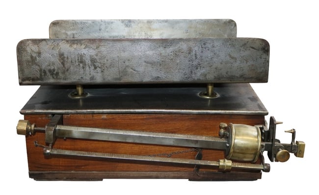 French mercantile scale in iron and bronze: French mercantile scale in iron and bronze. Late 19th century. 13"h x 25"w x 19 1/2"d. Weight: 55lbs