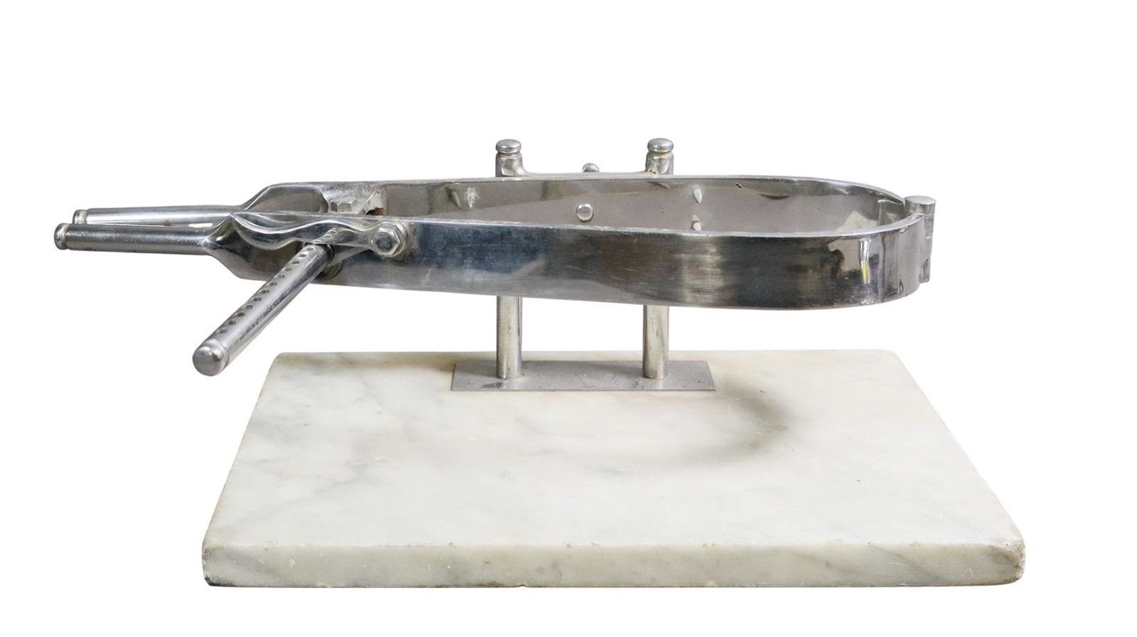 Italian marble and stainless steel presentation ham holder.: Italian marble and stainless steel presentation ham holder. The stainless steel u-shape clamp is designed to hold prosciutto or Iberico ham leg for carving. Late 20th century. 7"h x 22"w x 10"d