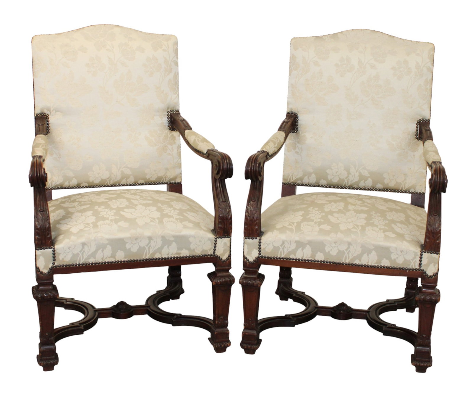 Pair of French Louis XIV style carved walnut armchairs with white floral upholstery.: Pair of French Louis XIV style carved walnut armchairs with white floral upholstery. Early 20th century. 42 1/2"h x 26 1/4"w x 23 1/2"d Seat 18"h