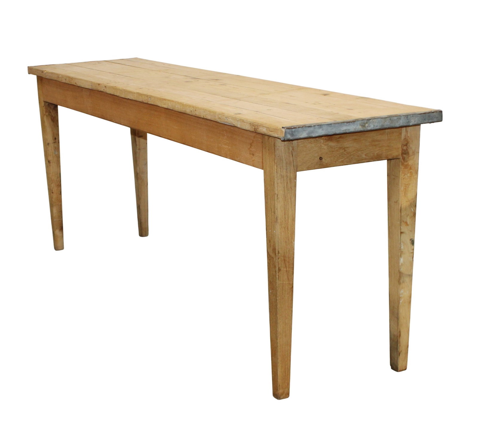 French workshop table in pine with zinc trim and tapered legs: French workshop table in pine with zinc trim and tapered legs. Mid 20th century. 30"h x 78 3/4"l x 19 1/4"w