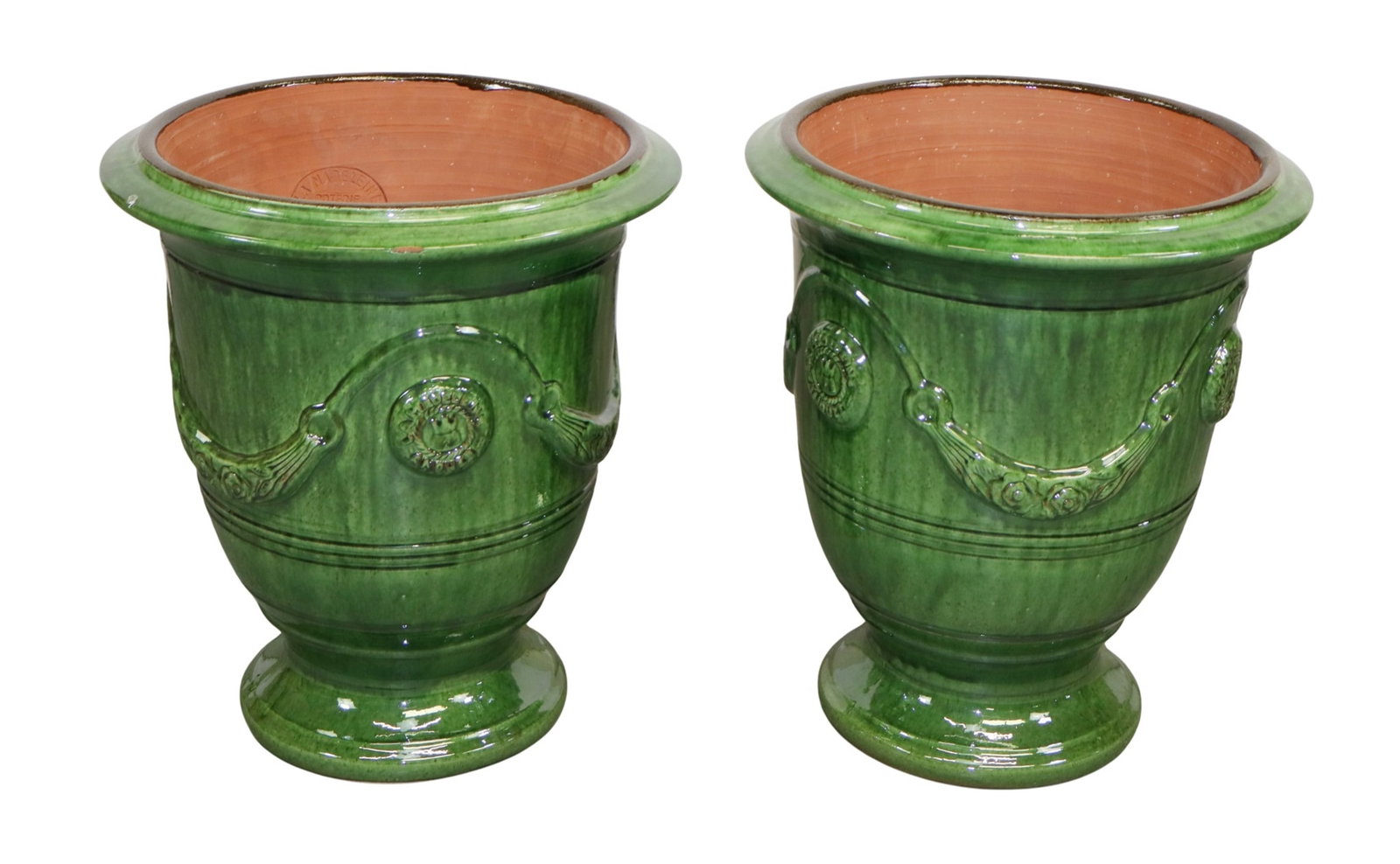 Pair of French Anduze La Madeleine green glazed garden urns: Pair of French Anduze La Madeleine green glazed terra cotta garden urns. 21 1/2"h x 18 3/4"dia