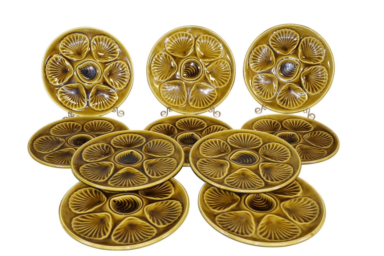Set of 10 French green ceramic oyster plates: Set of 10 French green ceramic oyster plates. Mid 20th century. 3/4"h x 9 3/8"dia. Weight: 13 lbs. total