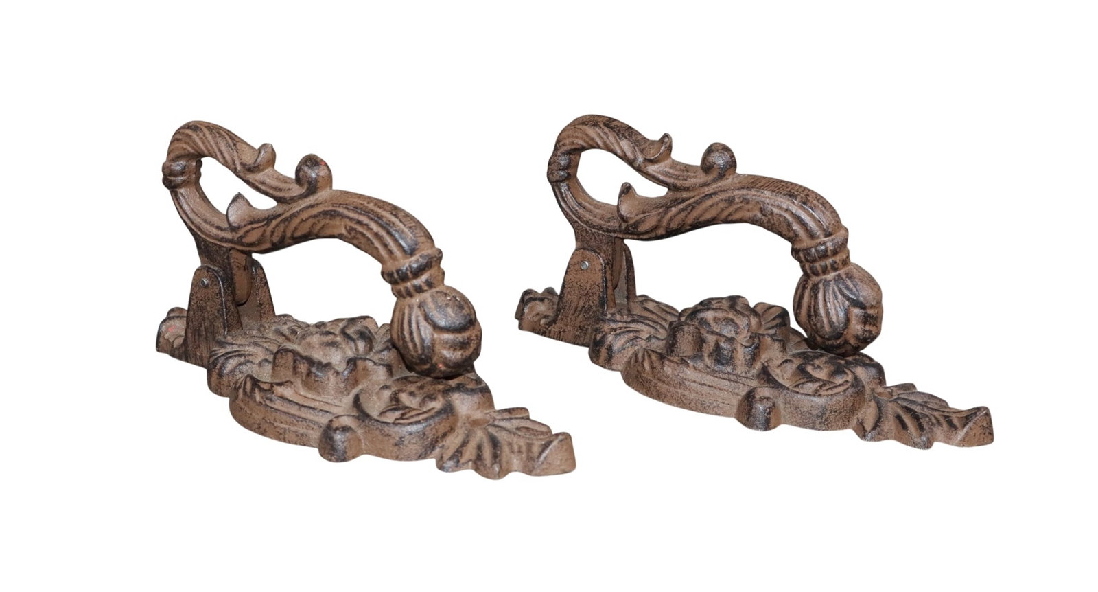 Lot of 2 cast iron door knockers with rose back plates: Lot of 2 cast iron door knockers with rose back plates. Late 20th century. 8 /2"h x 3 1/2"w x 3 1/2"d. Weight: 2lbs each