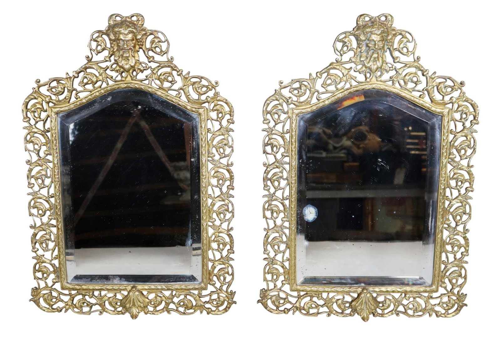 Pair of bronze relief mirrors with Bacchus masks: Pair of bronze relief mirrors with Bacchus masks. 19 3/4"h x 13 1/2"w x 2"d Weight: 20lbs total