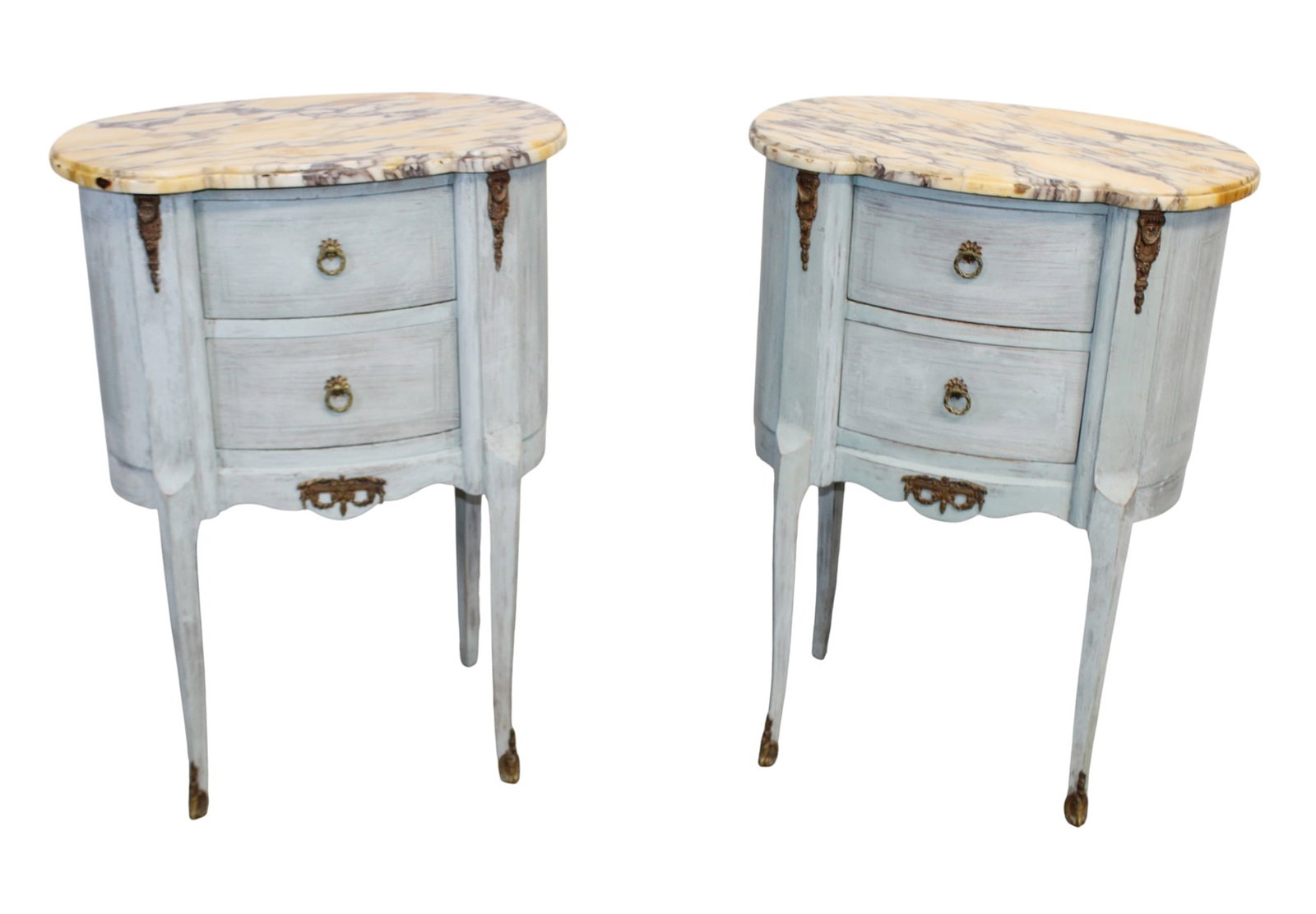 Pair of French Louis XVI style curved side tables on legs: Pair of French Louis XVI style curved side tables on legs with bronze mounts and marble tops. Early 20th century. 30 1/4 x 21 3/4"w x 13"d
