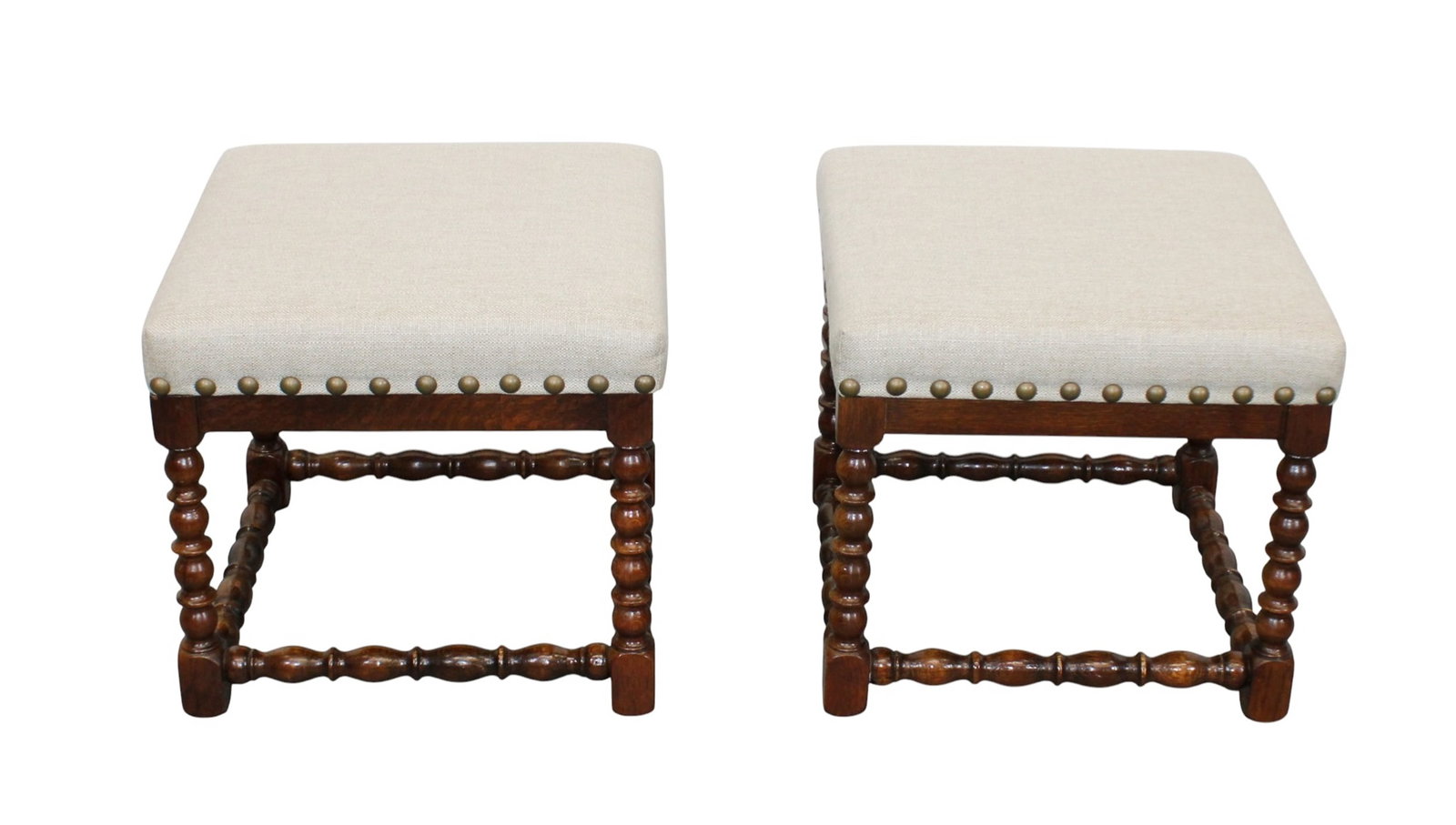 Pair of English spindle leg oak stools with studded linen upholstered seats: Pair of English spindle leg oak stools with studded linen upholstered seats. Late 19th century with modern upholstery. 16"h x 17 1/4 squared