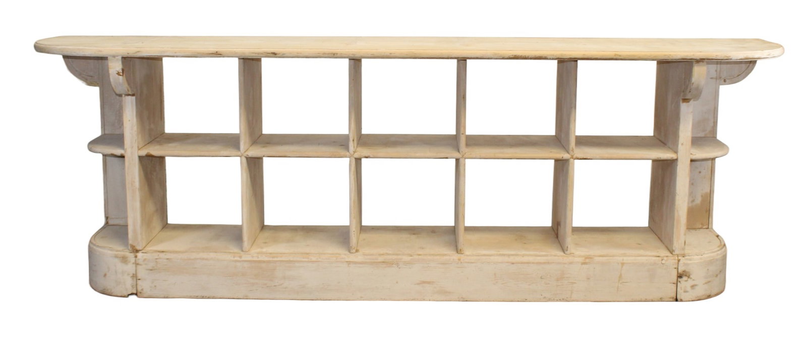French custom store counter with cubbies from the Ralph Lauren boutique in Avignon: French custom store counter with cubbies from the Ralph Lauren boutique in Avignon France. In pine with a paint wash finish. Late 20th century. 40"h x 118"l x 23 1/2"d