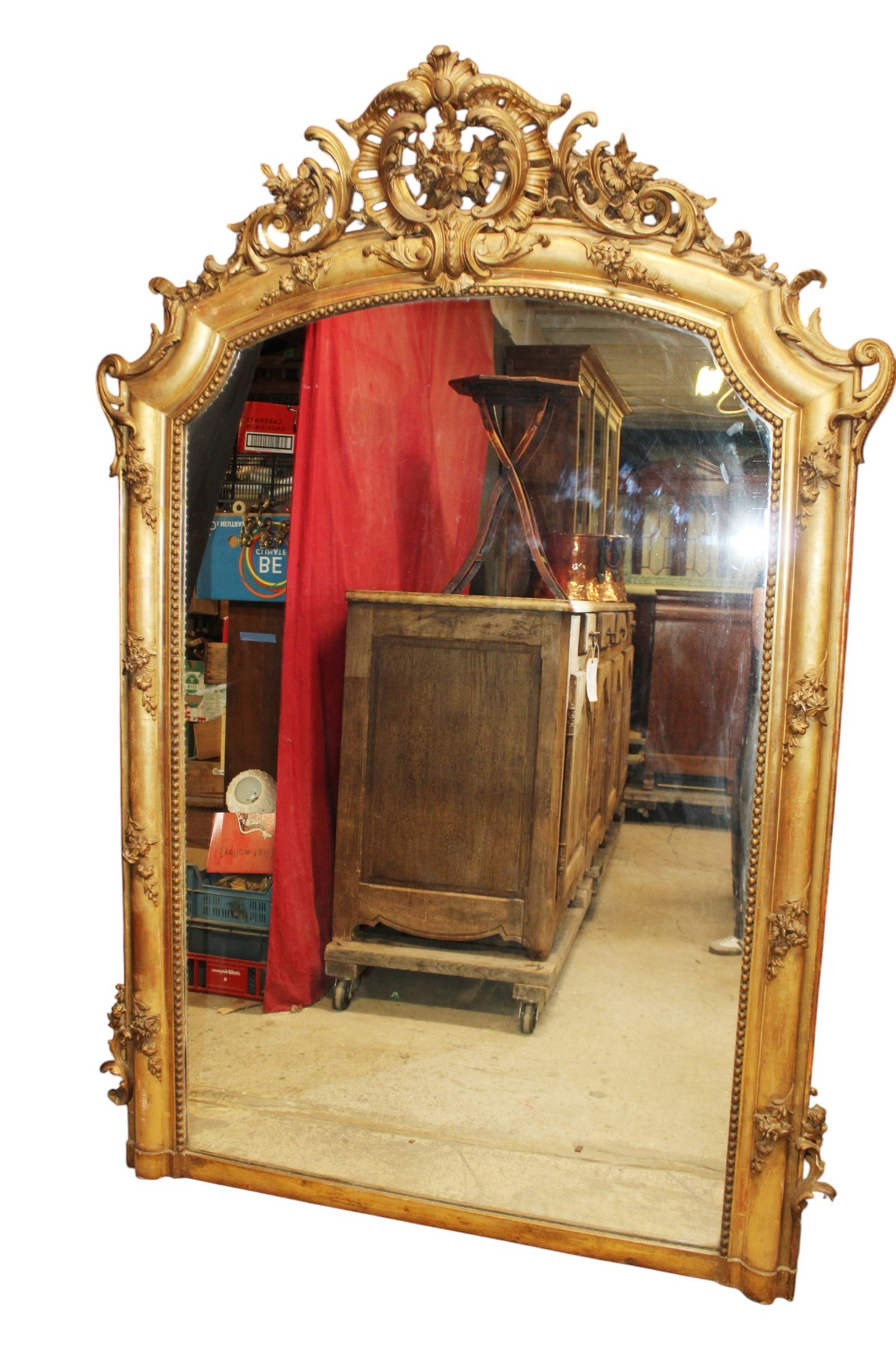 French Louis XV gold leaf mirror: French Louis XV gilt mirror with acanthus scroll crest with flowers. 19th century. 74 1/4"h x 50"w