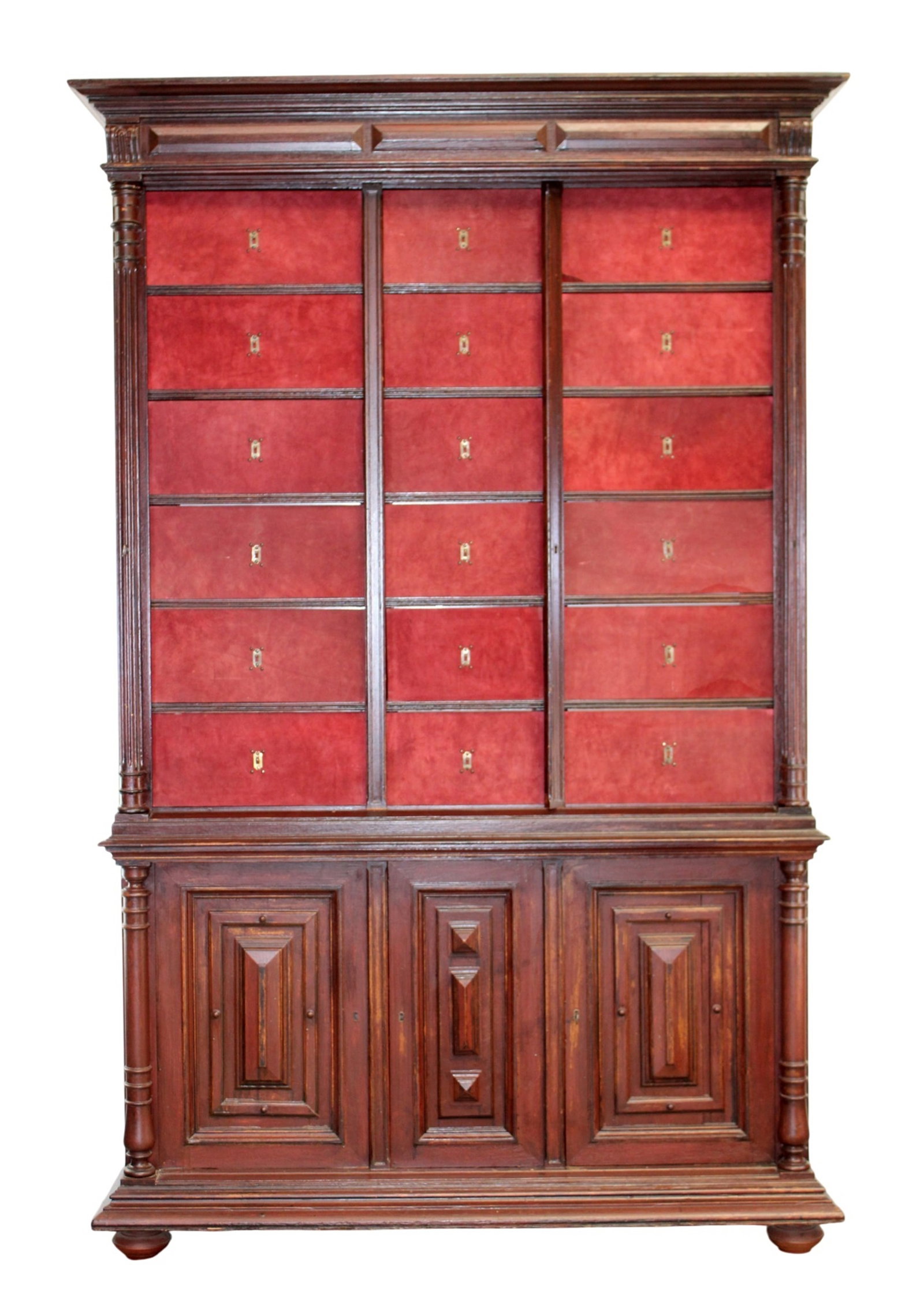 French Renaissance Revival notary cabinet in oak with 18 cubbies: French Renaissance Revival notary cabinet in carved oak with 18 lift front cubbies and a faux painted finish. Late 19th century. 93 1/2"h x 60"w x 22"d at the crown