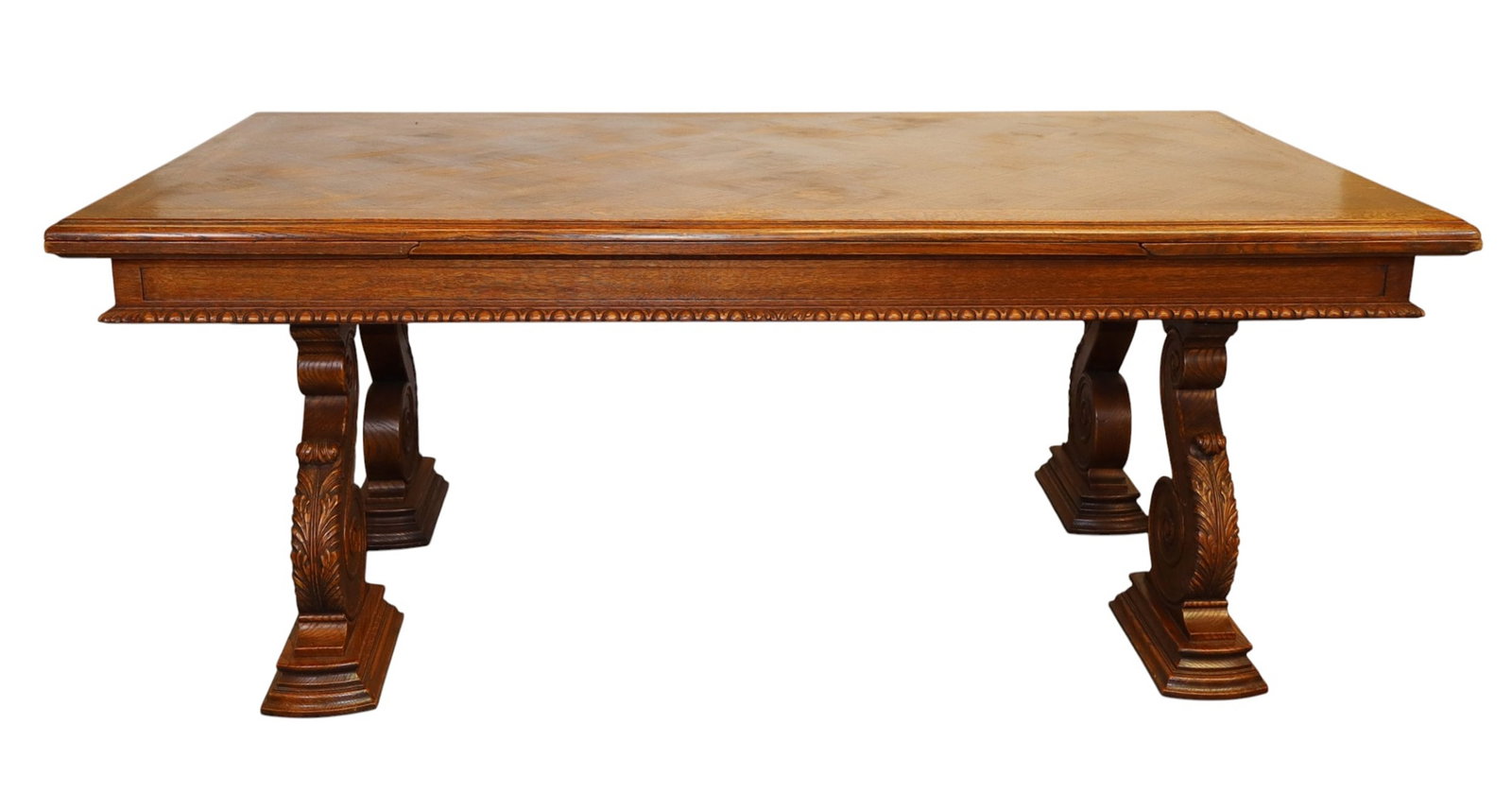 Spanish Renaissance draw leaf table with carved scroll legs: Spanish Renaissance Revival draw leaf table with carved scroll legs. Early 20th century. 31"h x 70 1/2"l x 43 1/4"d, 109 1/2"l with leaves out