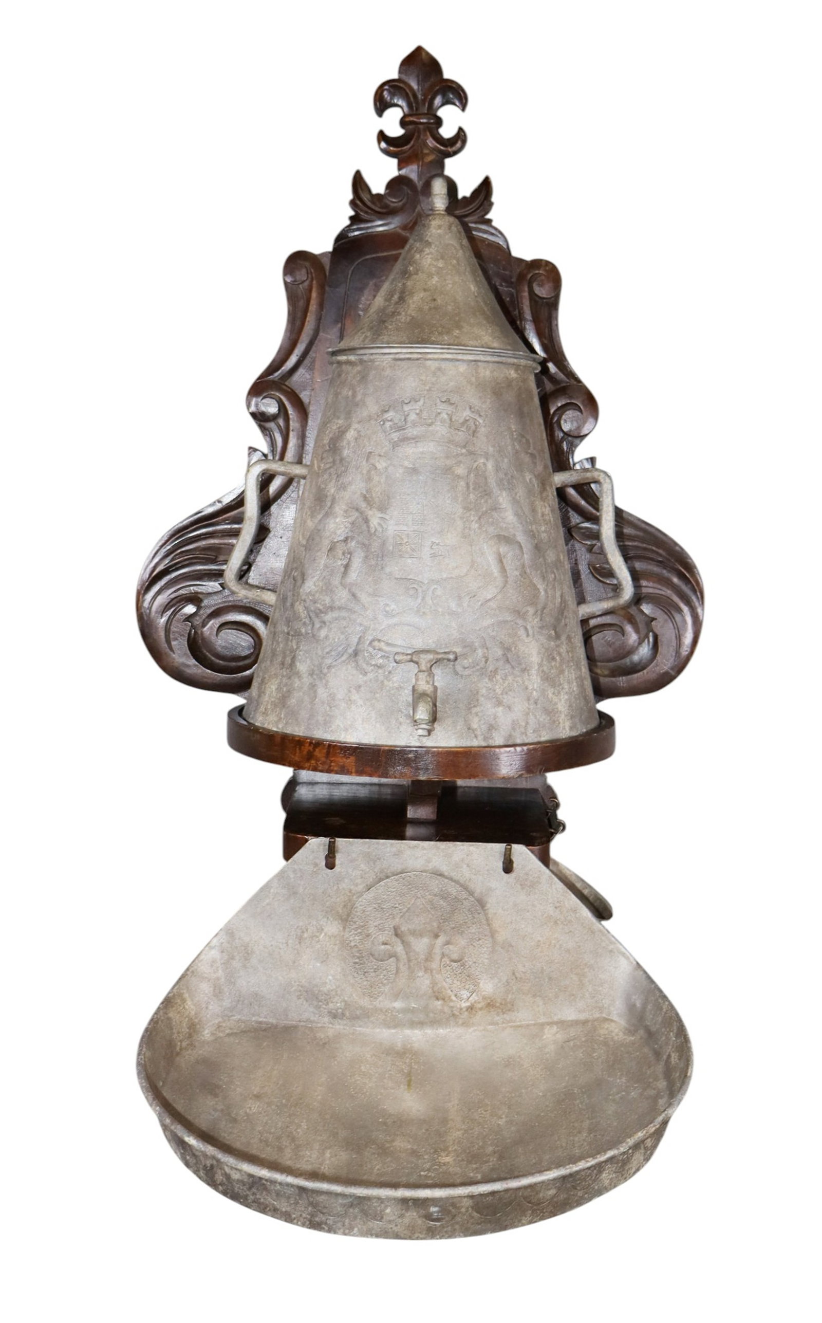 French wall mount lavabo wash stand in zinc with carved walnut stand: French wall mount lavabo wash stand in zinc with carved walnut stand. 19th century. 35"h x 19"w x 20"d overall. Weight: 10lbs
