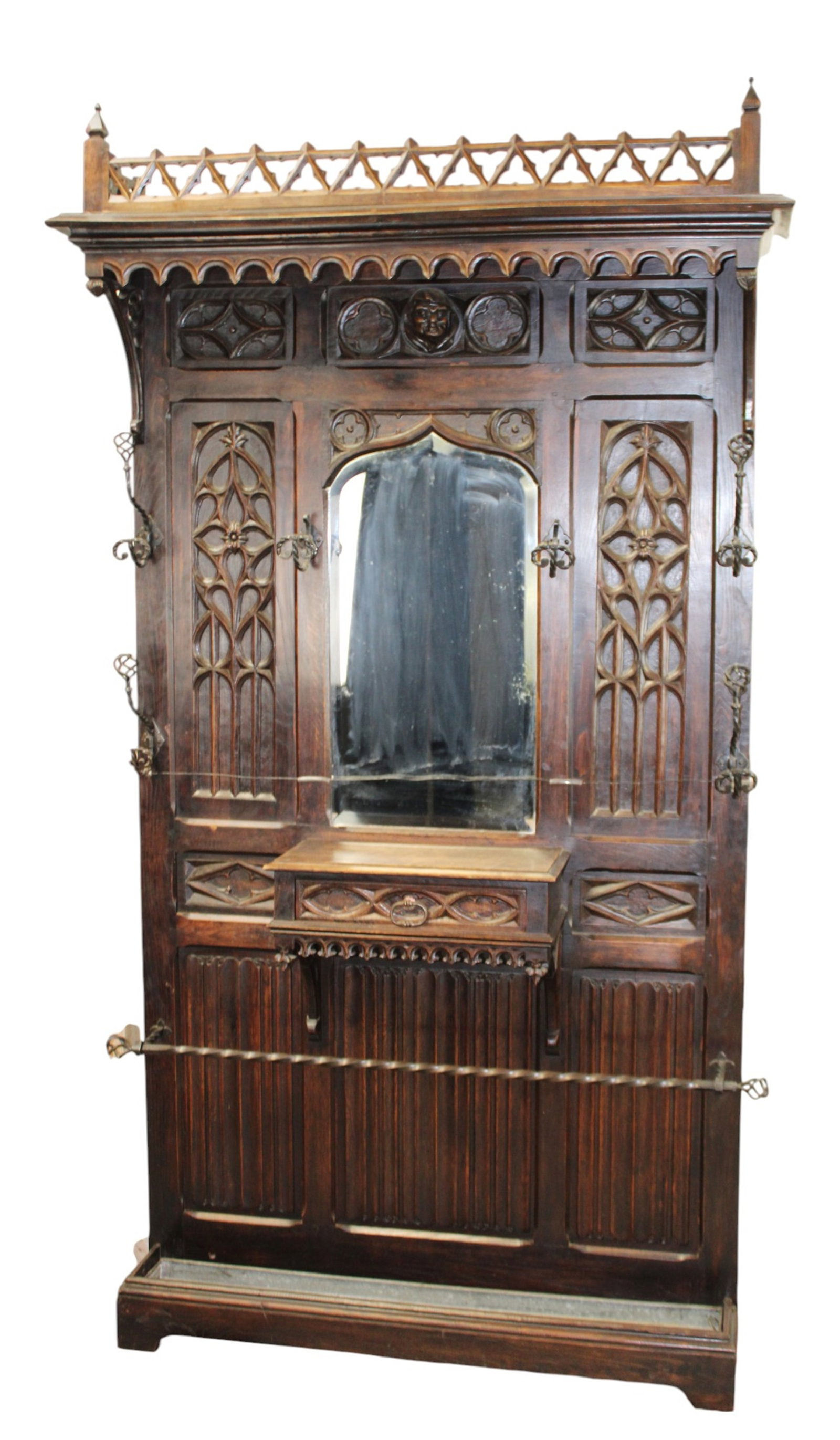 French Gothic Revival style hall tree in carved oak with iron hardware and linenfold panels: French Gothic Revival style hall tree in carved oak with iron hardware and linenfold panels. Early 20th century. 93"h x 54"w x 13"d