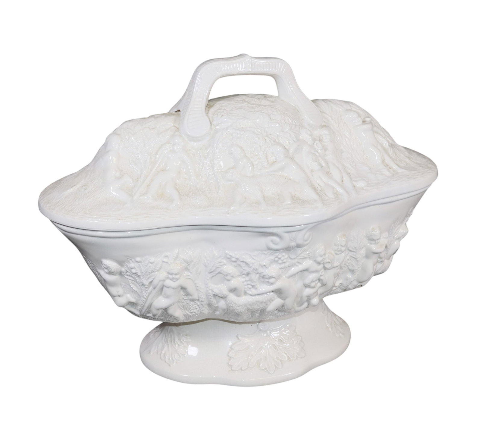 Ceramic lidded tureen with relief cherub scene: Ceramic lidded tureen with relief cherub scene. Artist signed and dated. 11 3/4"h x 15 1/4"w x 9 1/2"d