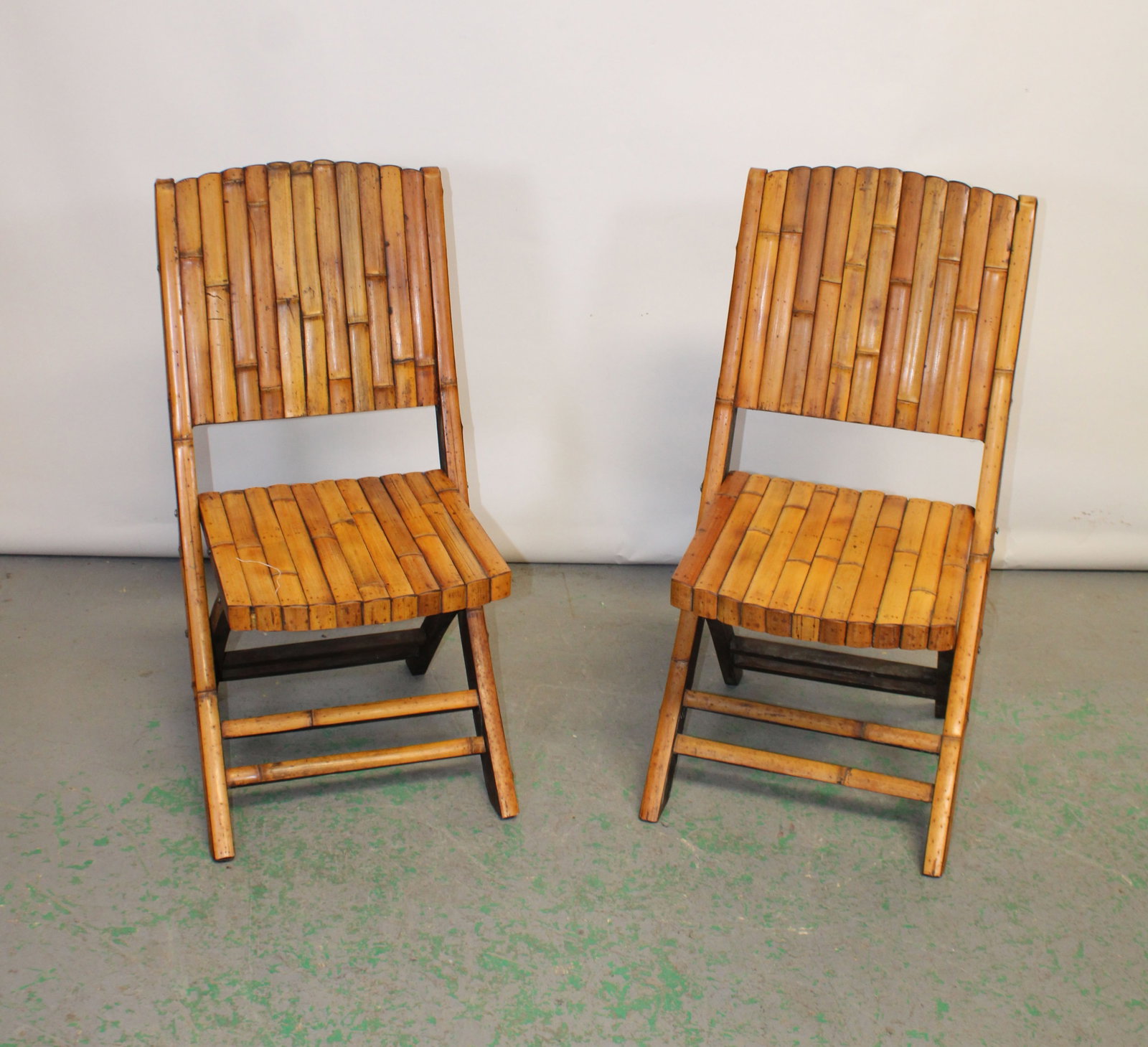 Pair of reeded bamboo folding chairs