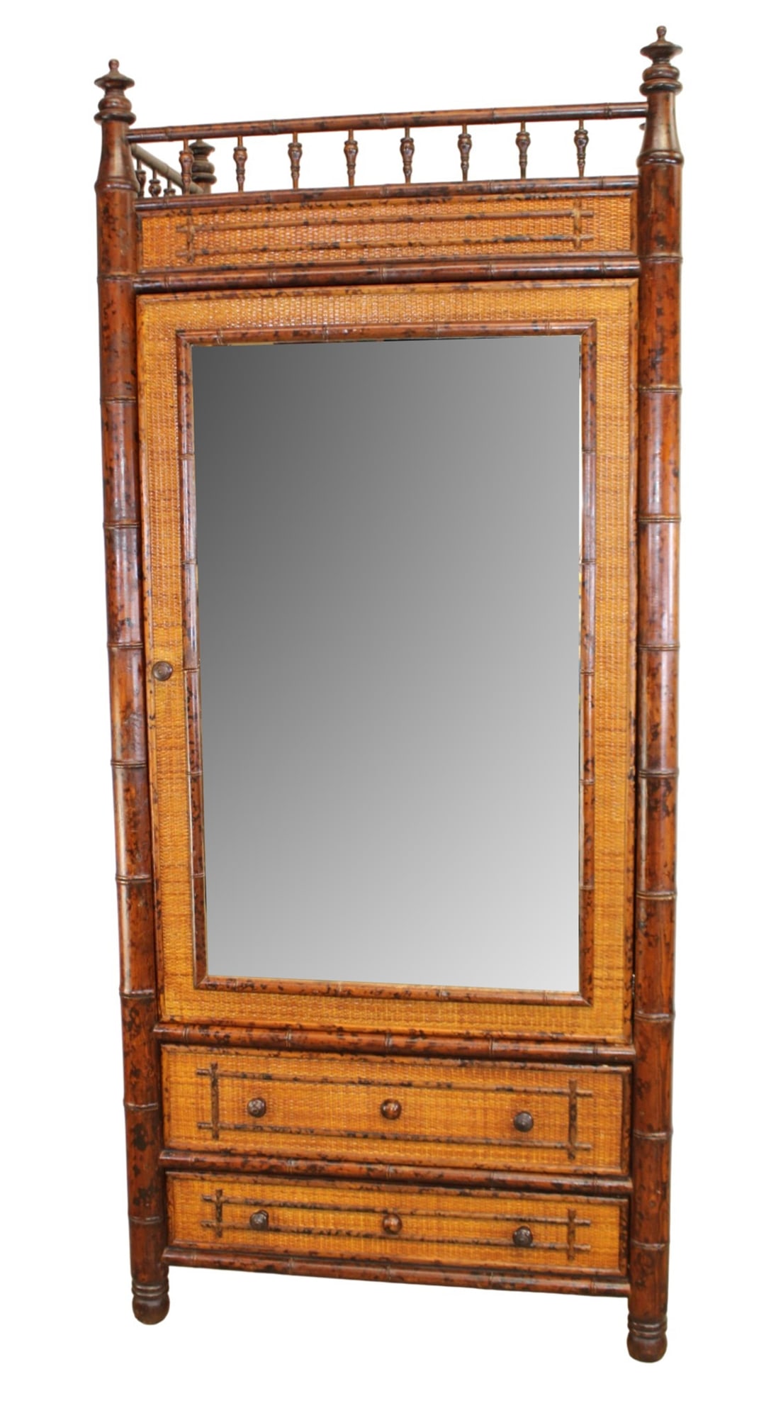 Tortoise bamboo and woven rattan mirrored armoire with top gallery rail and lower drawers: Tortoise bamboo and woven rattan mirrored armoire with top gallery rail and lower drawers. Late 20th century. 87"h x 38"w x 22"d