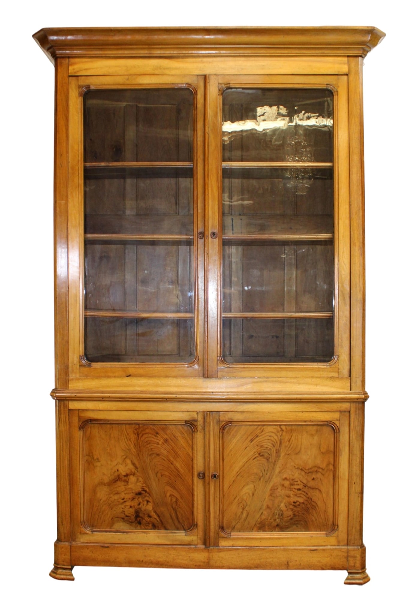 French Louis Philippe deux corps bookcase in walnut: French Louis Philippe deux corps bookcase in walnut. 19th century. 91"h x 58"w x 20"d