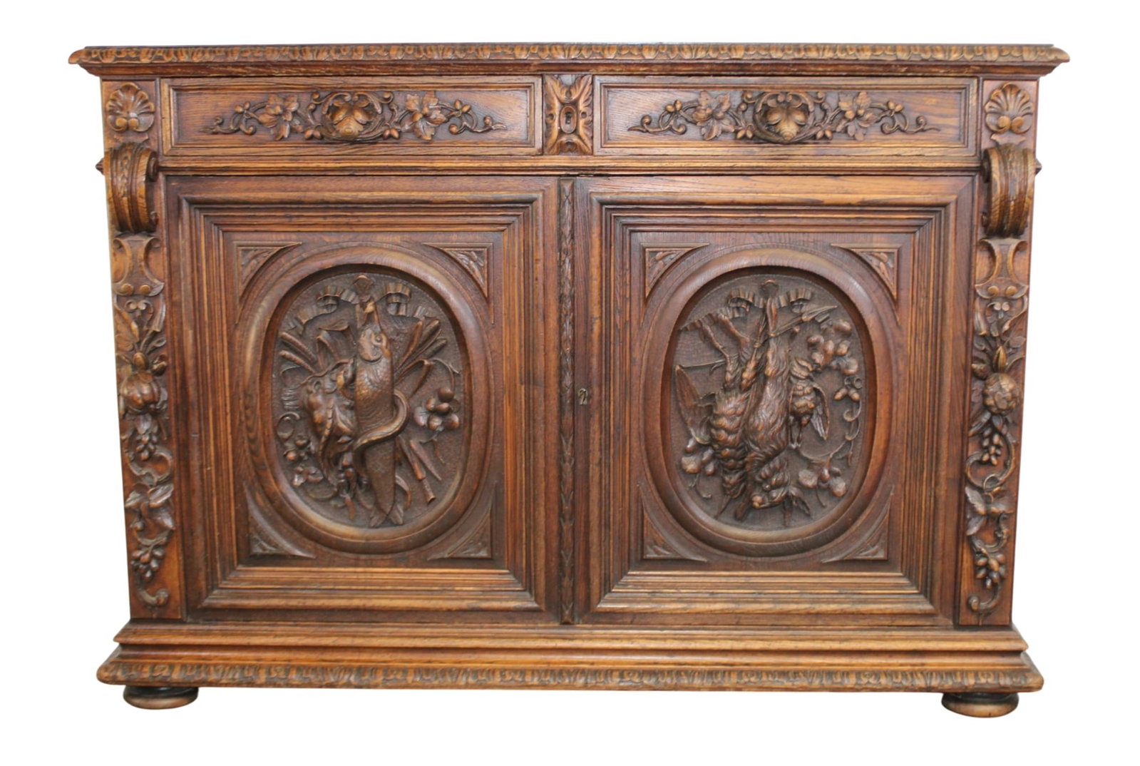 French hunt buffet bas in oak with relief carved hunt motif plaques: French hunt buffet bas in oak with relief carved hunt motif plaques. 19th century. 39 1/2"h x 55"w x 21"d
