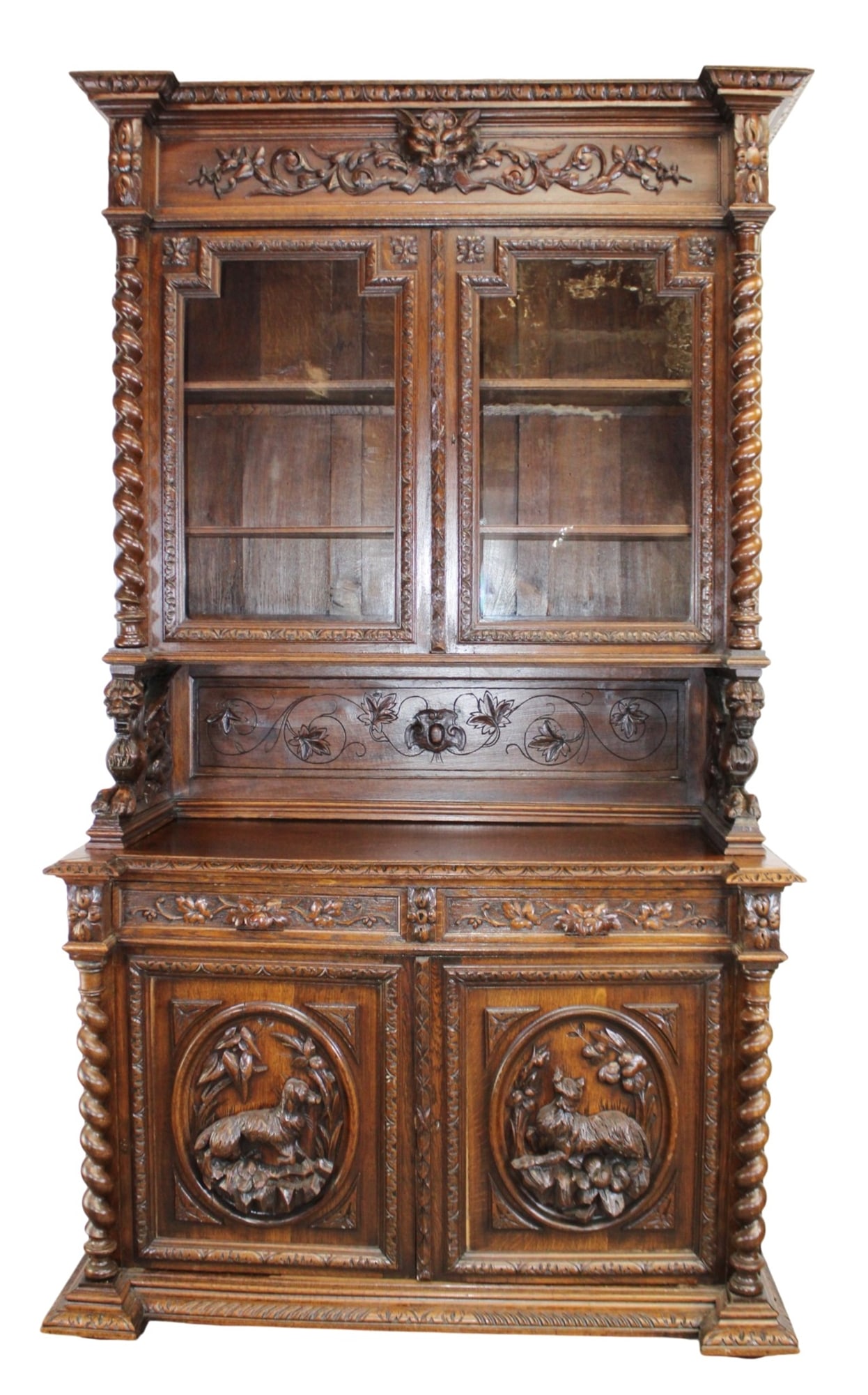 French hunt motif deux corps buffet in oak with relief carved door and griffin mounts: French hunt motif deux corps buffet in oak with relief carved door and griffin mounts. 19th century. 96 1/2"h x 56"w x 24 1/2"d