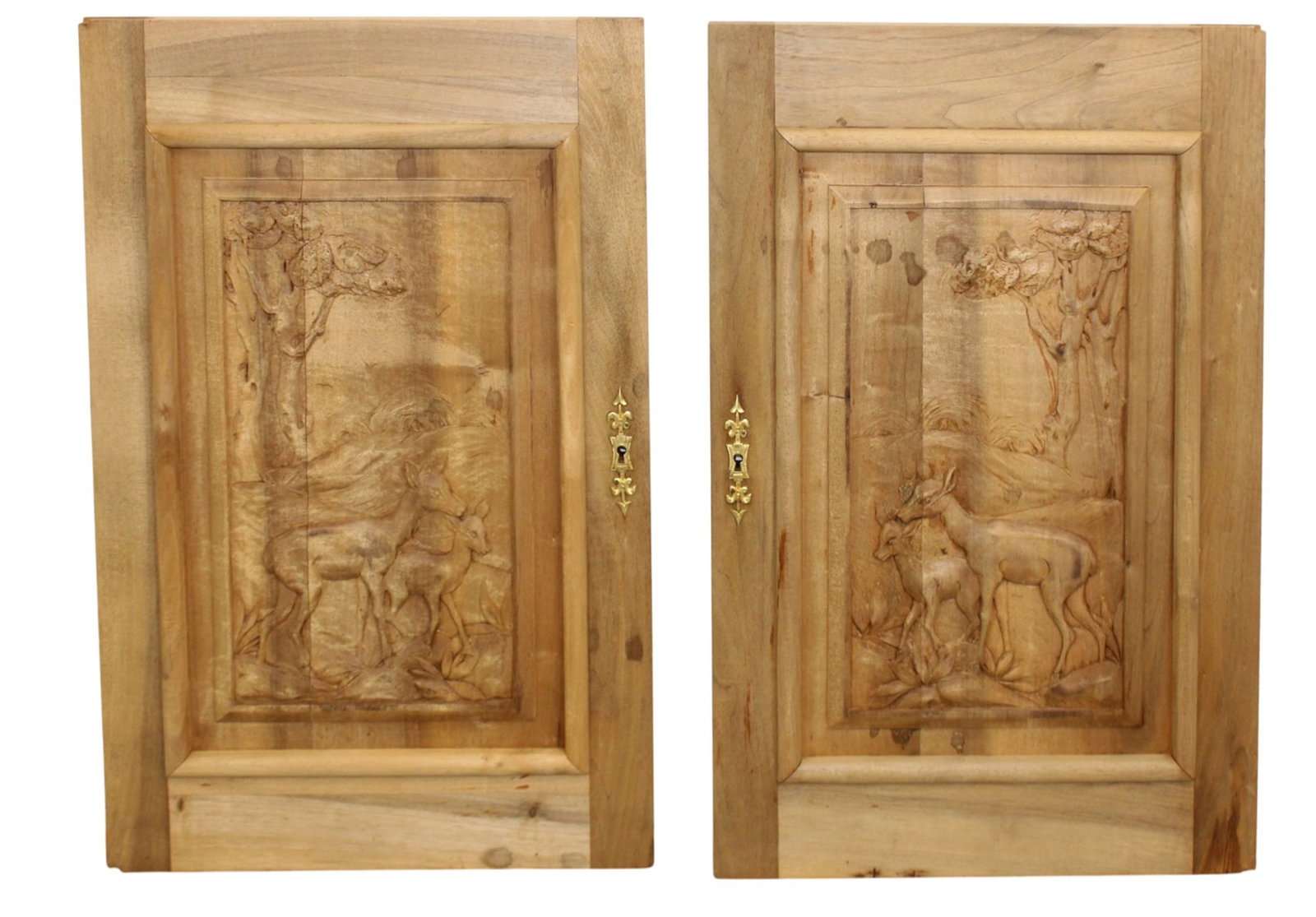 Pair of French relief carved walnut doors with deer: Pair of French relief carved walnut panels with deer. Late 19th century. Each: 29"h x 18 1/8"w x 1 3/8"d