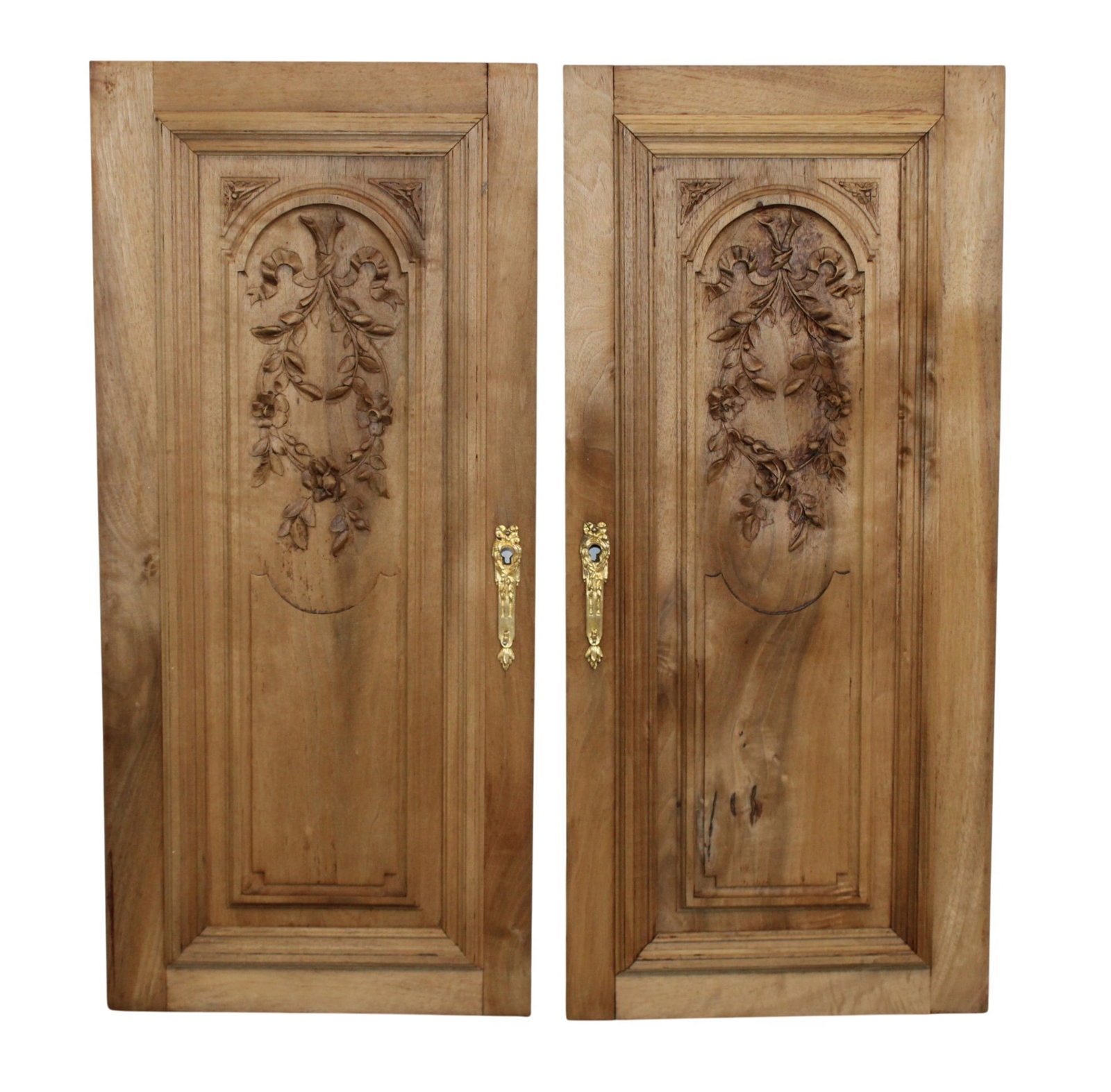 Pair of French relief carved doors as panels with floral and ribbon motifs: Pair of French relief carved doors as panels with floral and ribbon motifs. 28 1/2"h x 13"w