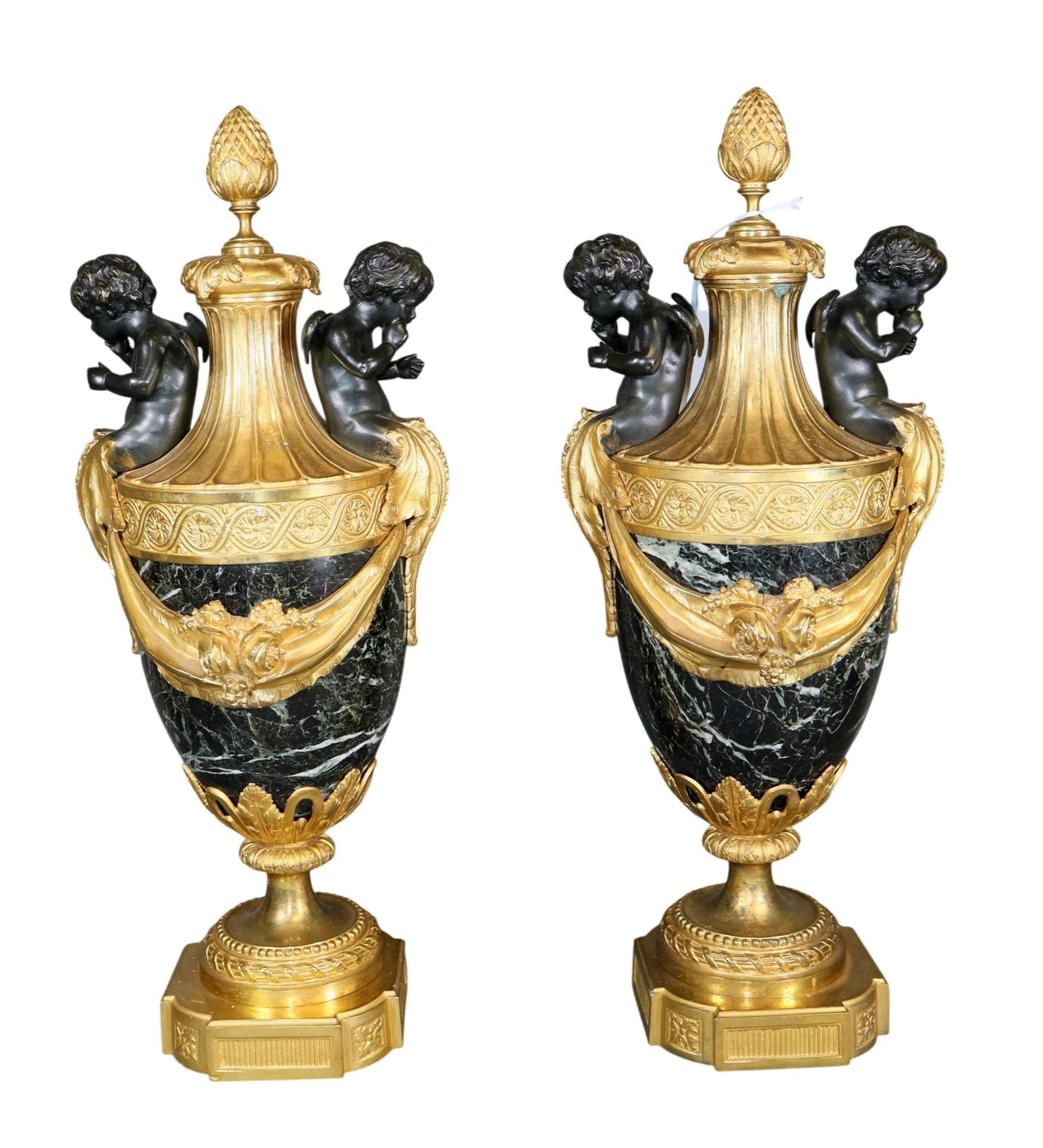 Pair of French Louis XVI style marble and gilt bronze urns with garland and seated putti (1 of 10)