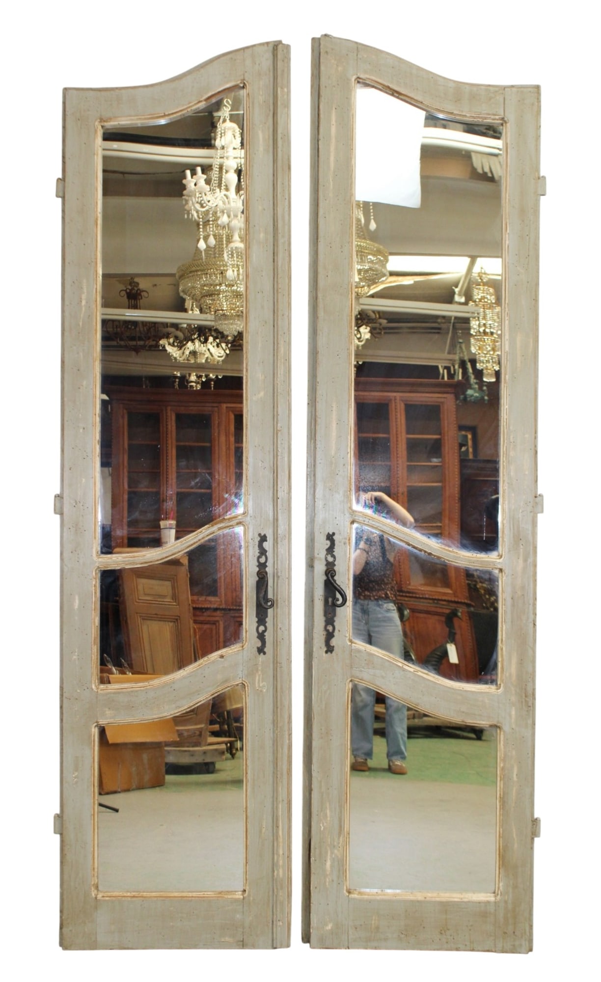 Pair of doors with arched mirrored panels and ornate iron handles (1 of 7)