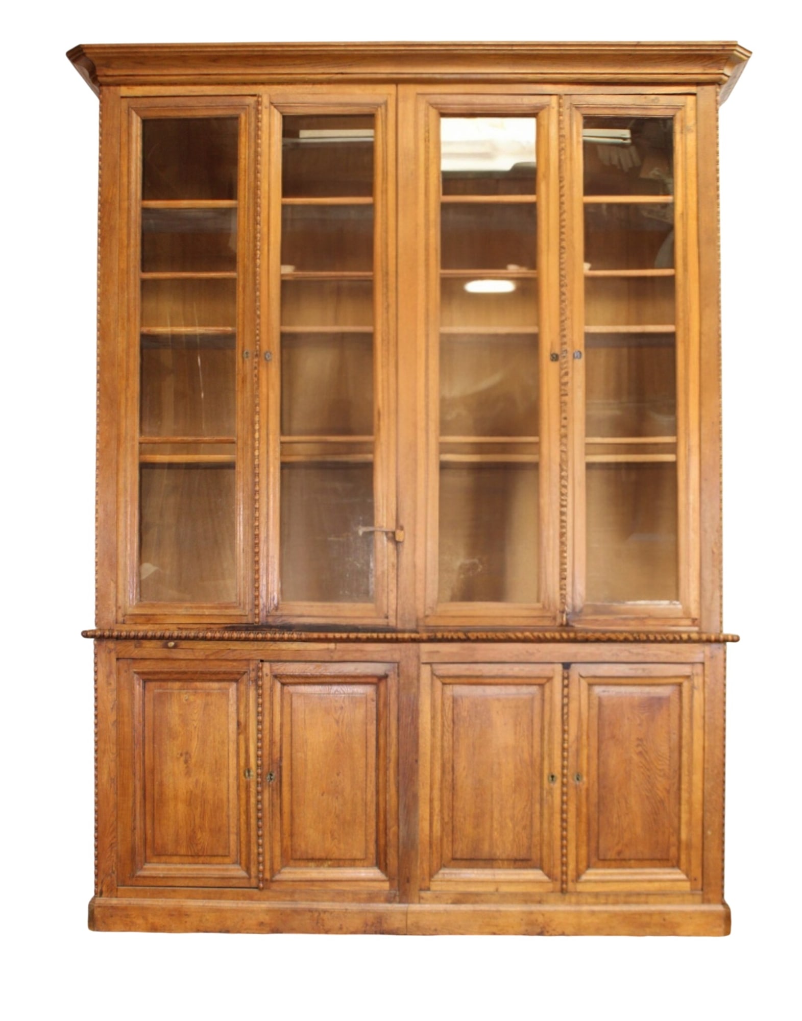French Neoclassical bookcase in oak with egg and dart molding and 2 pullout sides (1 of 12)