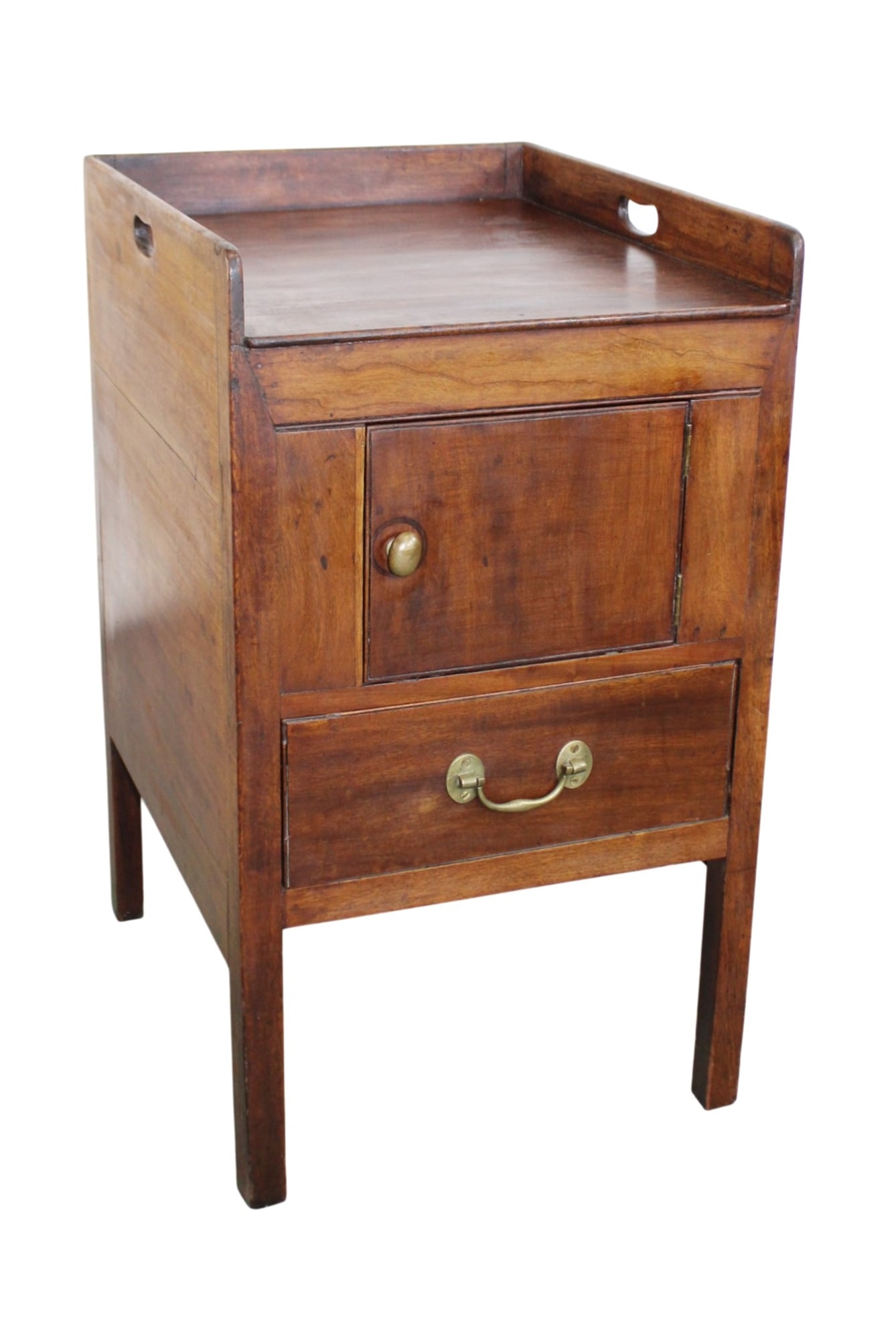 English bedside commode featuring a galleried tray top with side handles: English bedside commode in walnut with galleried tray top with side carrying handles, an upper cabinet door and a pull-out drawer. Late 19th century. 31"h x 18"w x 21 1/4"d