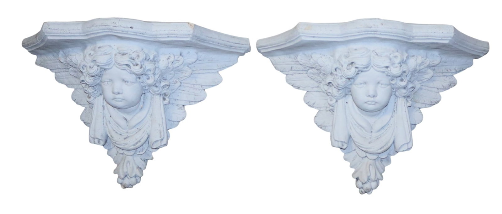 Pair of cast concrete relief cherub wall shelves: Pair of cast concrete relief cherub wall shelves. 11"h x 17"w x 6 1/2"d. Weight: